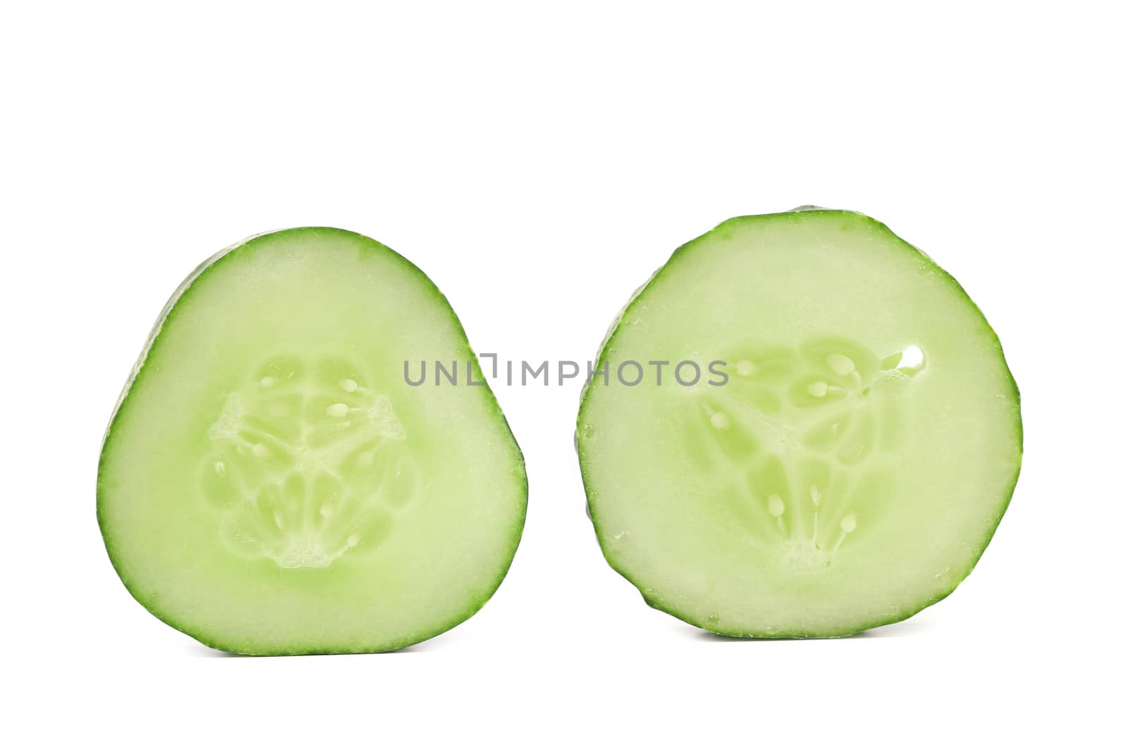 Fresh slices of cucumber on a white background