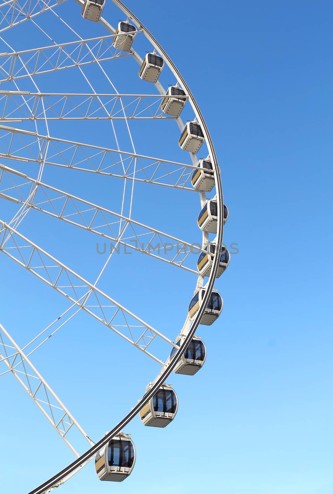 Ferris wheel against a blue sky