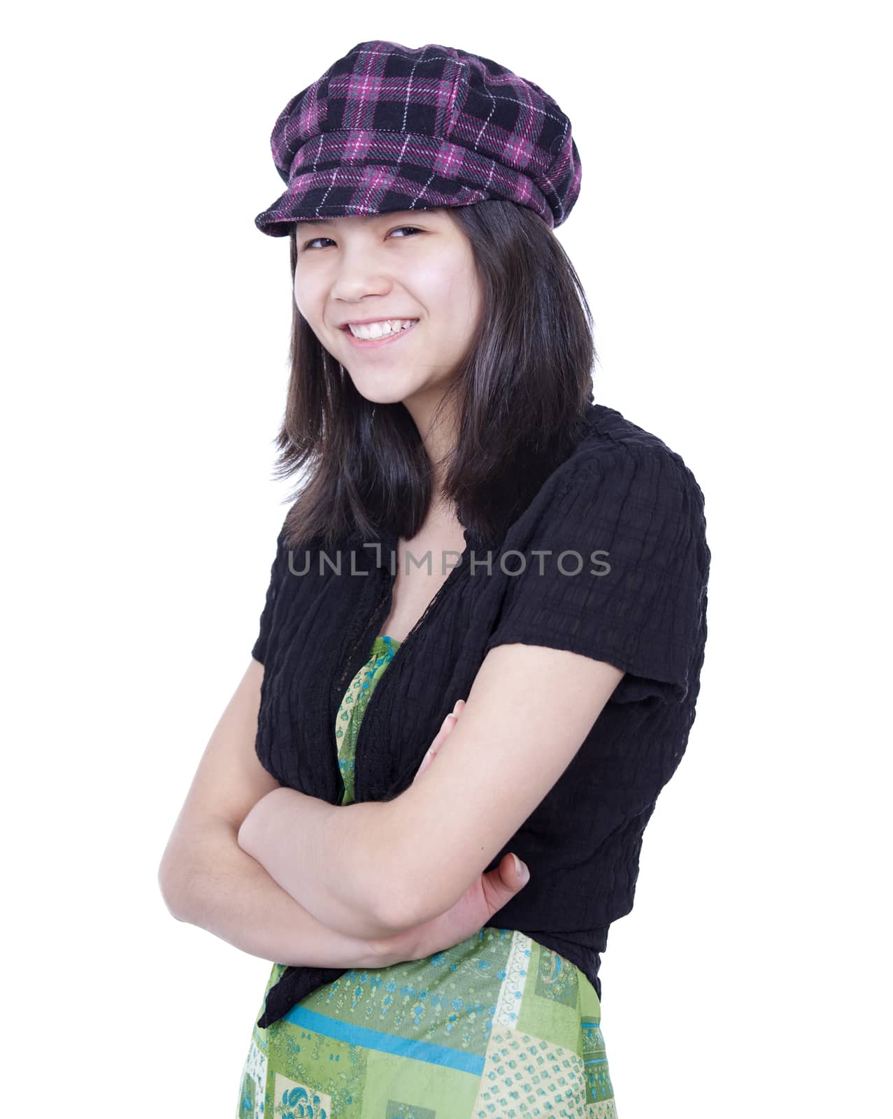 Young teen girl smiling, arms crossed, wearing hat by jarenwicklund