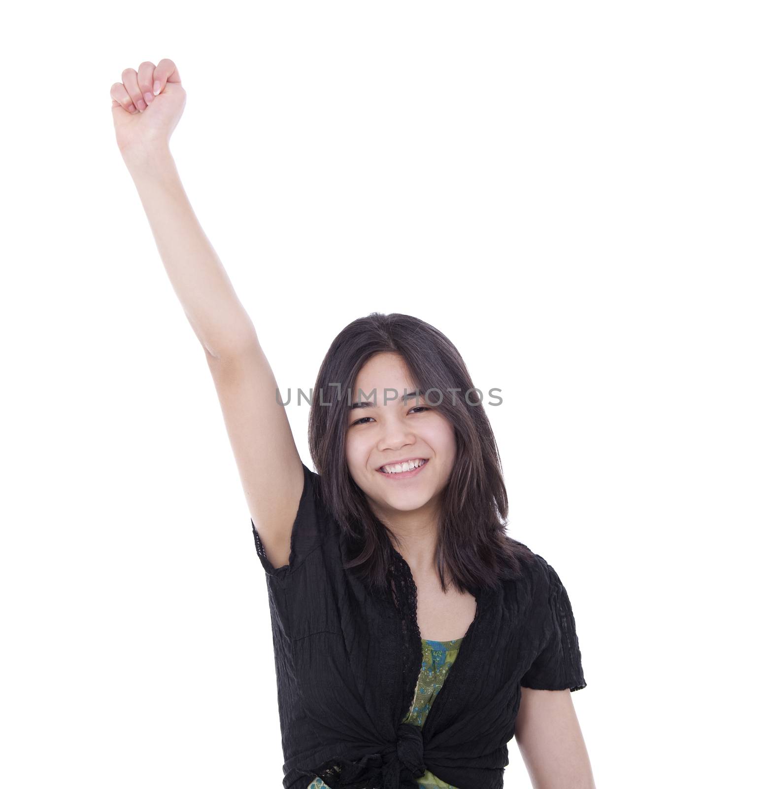 Confident young teen girl with one arm raised in success by jarenwicklund