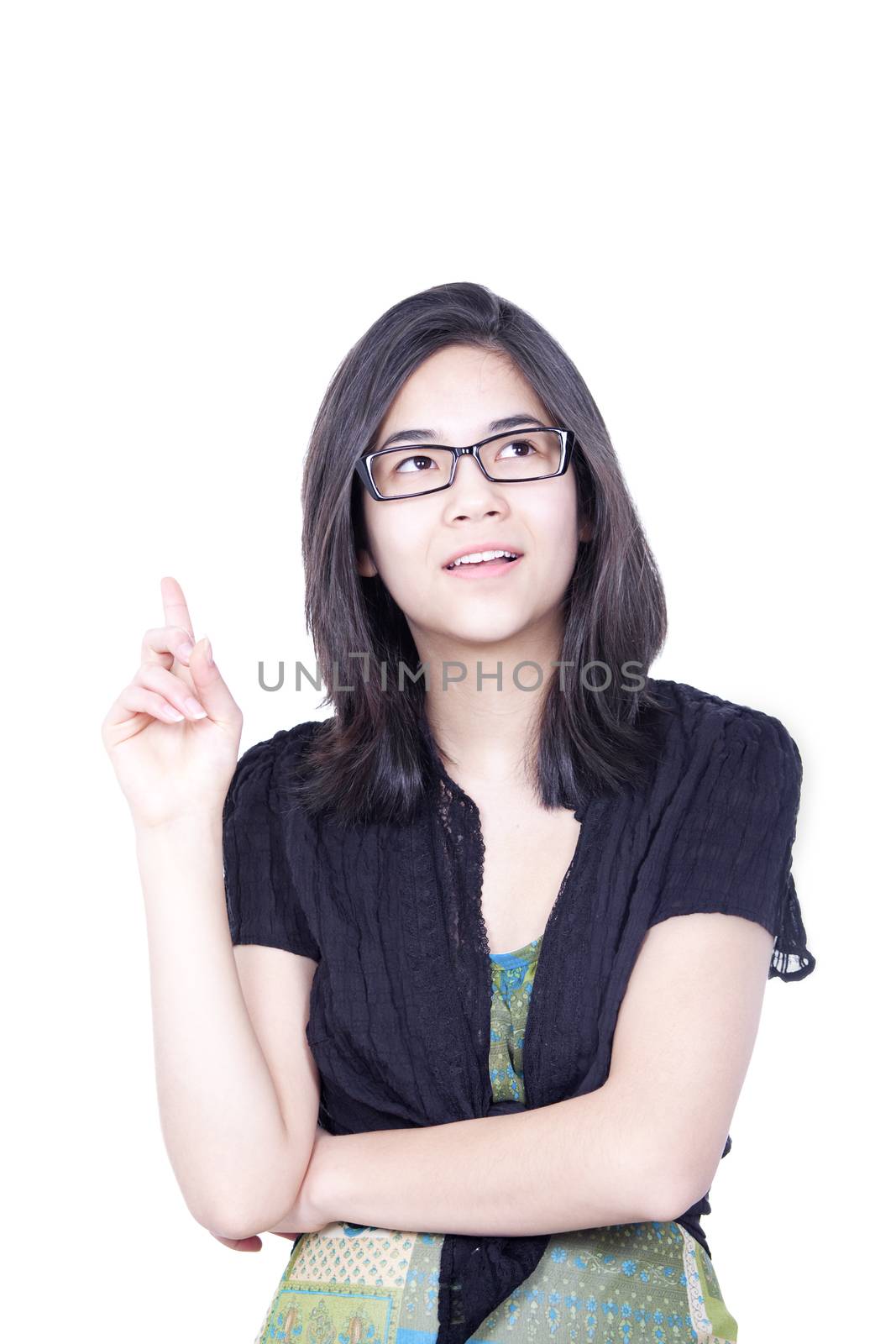 Young biracial teen girl, standing with raised finger pointing to sky, as if she just had a great idea come to mind.