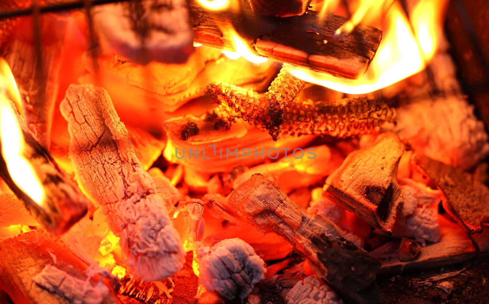 Blazing fire in Grilled. Close up. Whole background.
