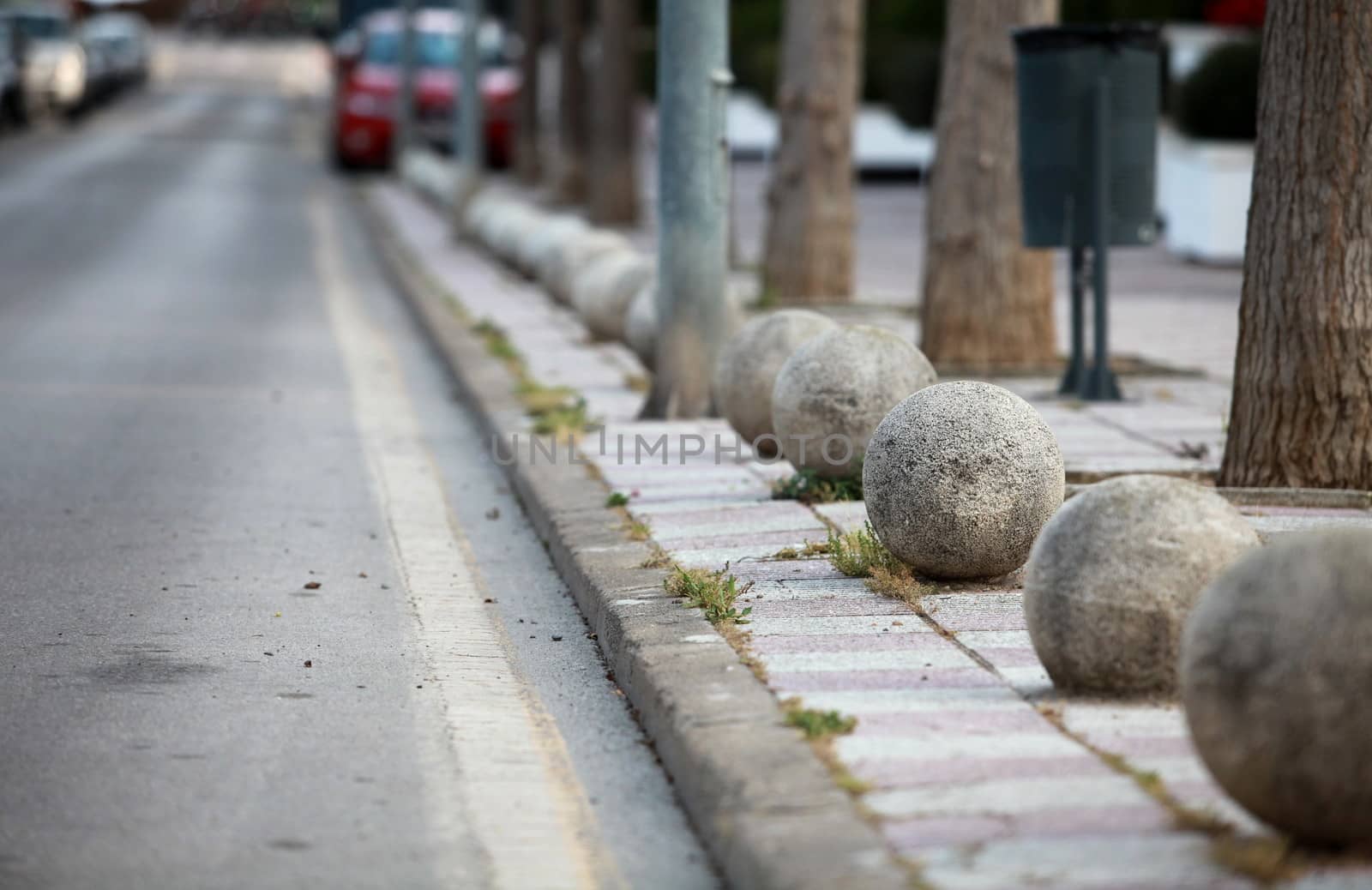 decorative fence of granite balls on a city street