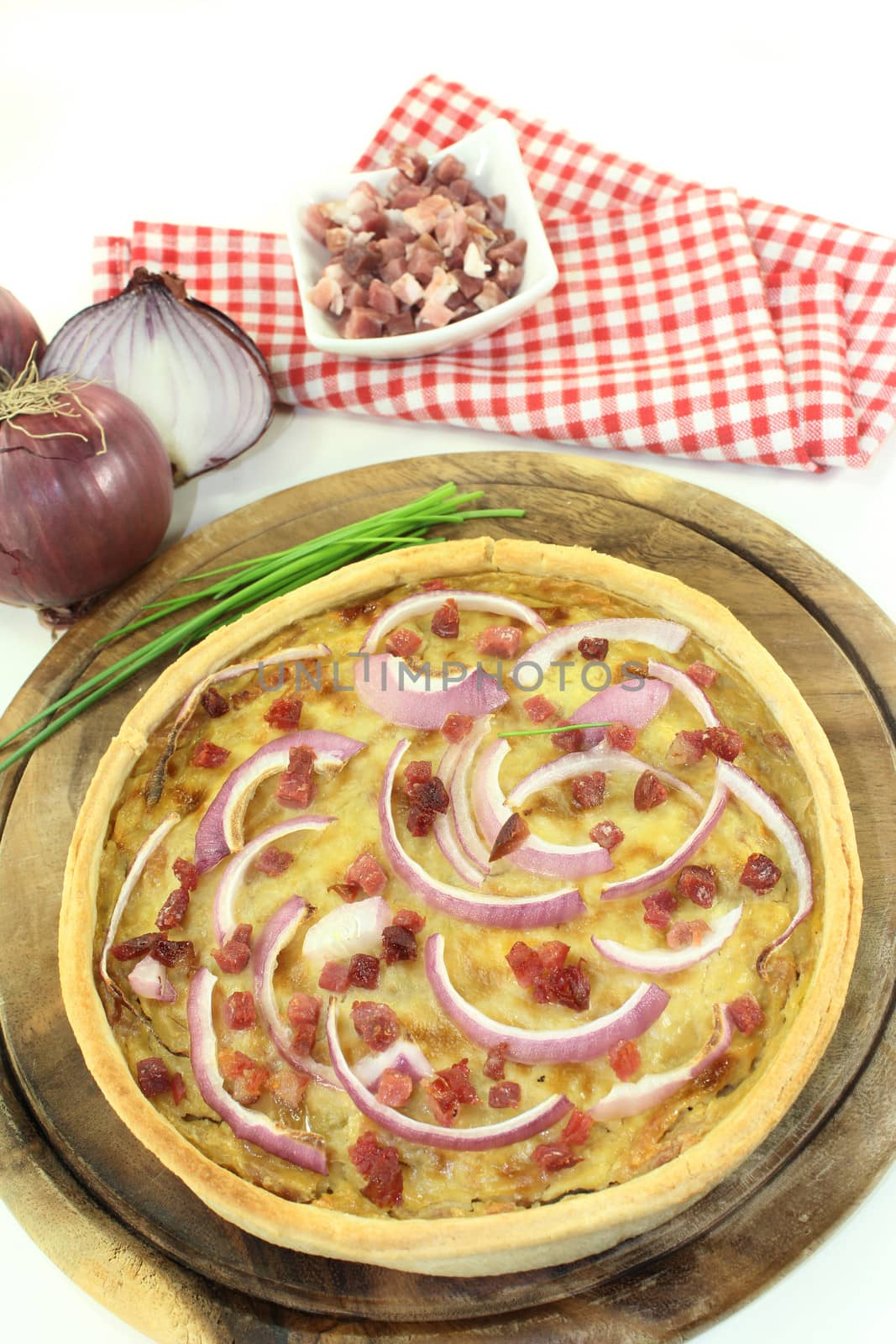 freshly baked onion tart with ham cubes