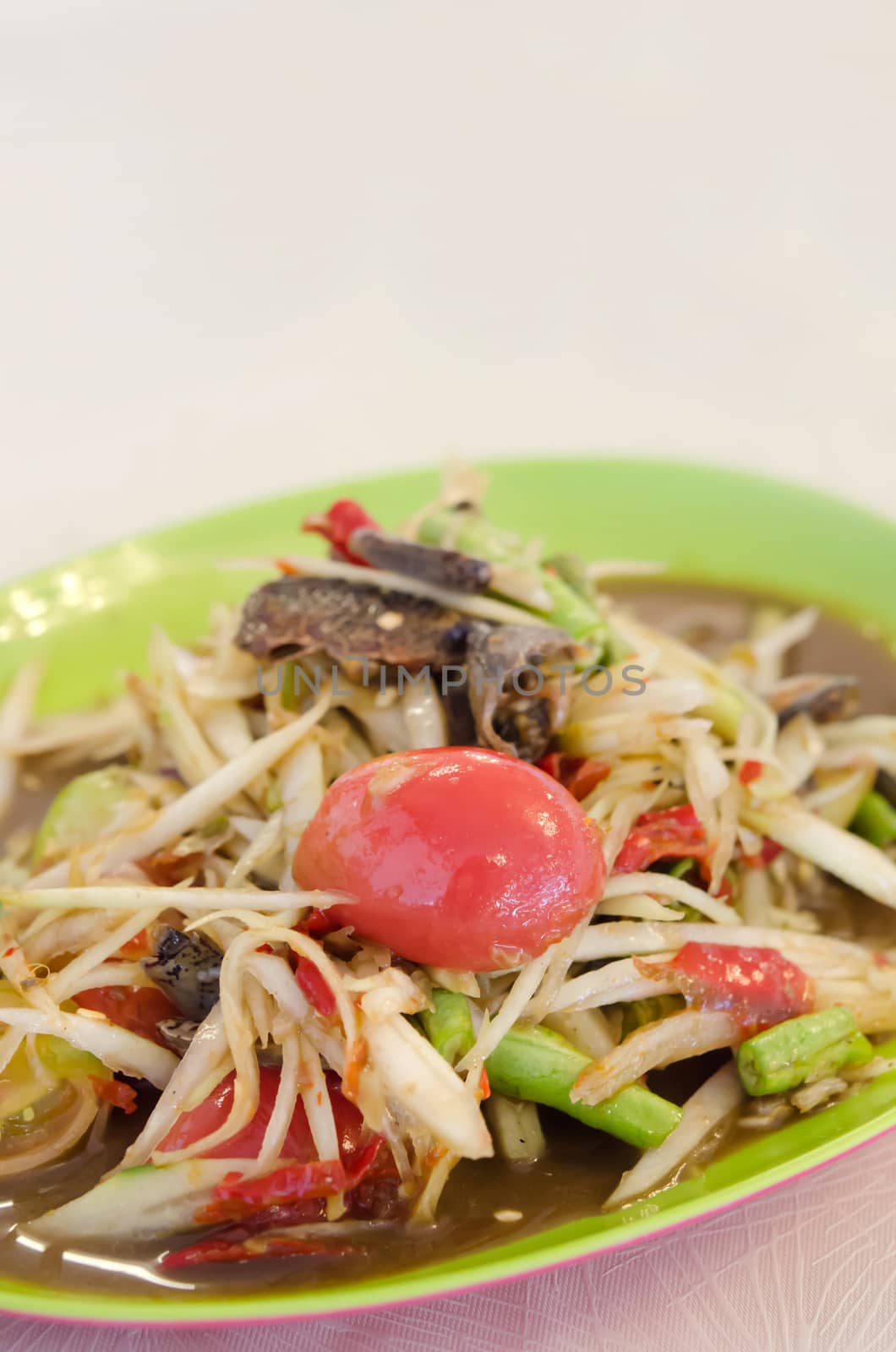close up spicy papaya salad with crab and vegetable 