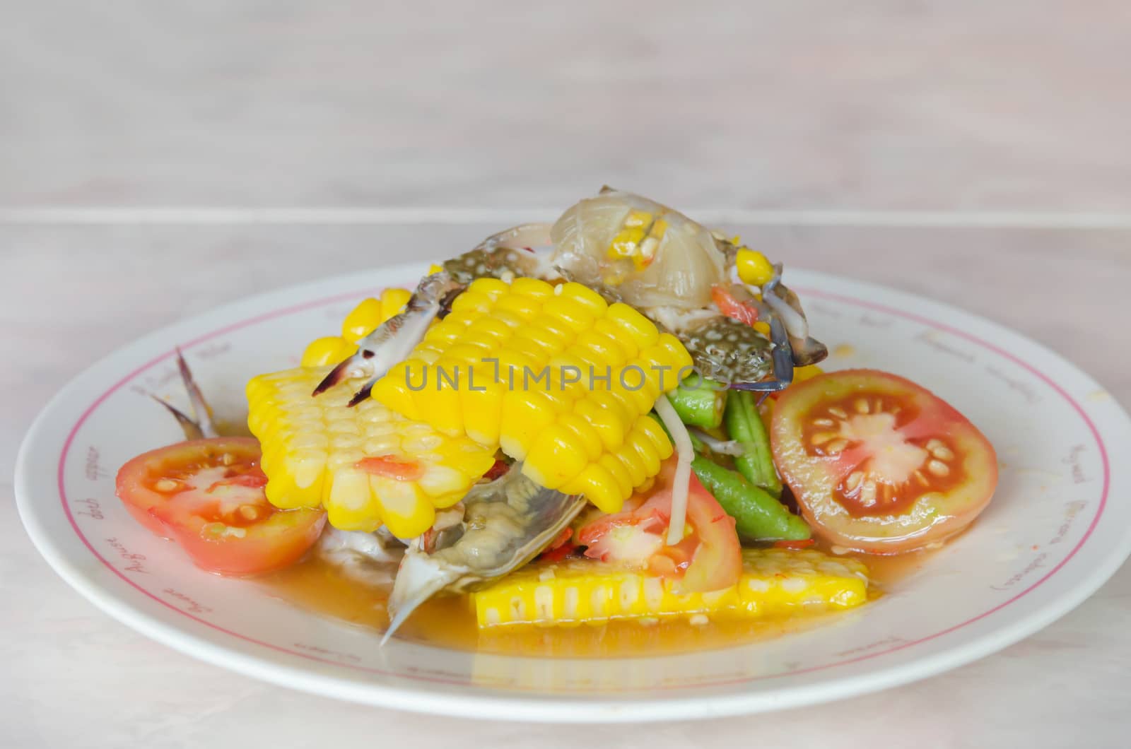 sweet corn  spicy salad with raw crab on dish
