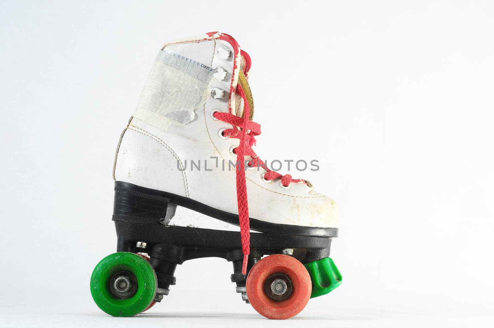 Used Vintage Consumed Roller Skate on a White Background