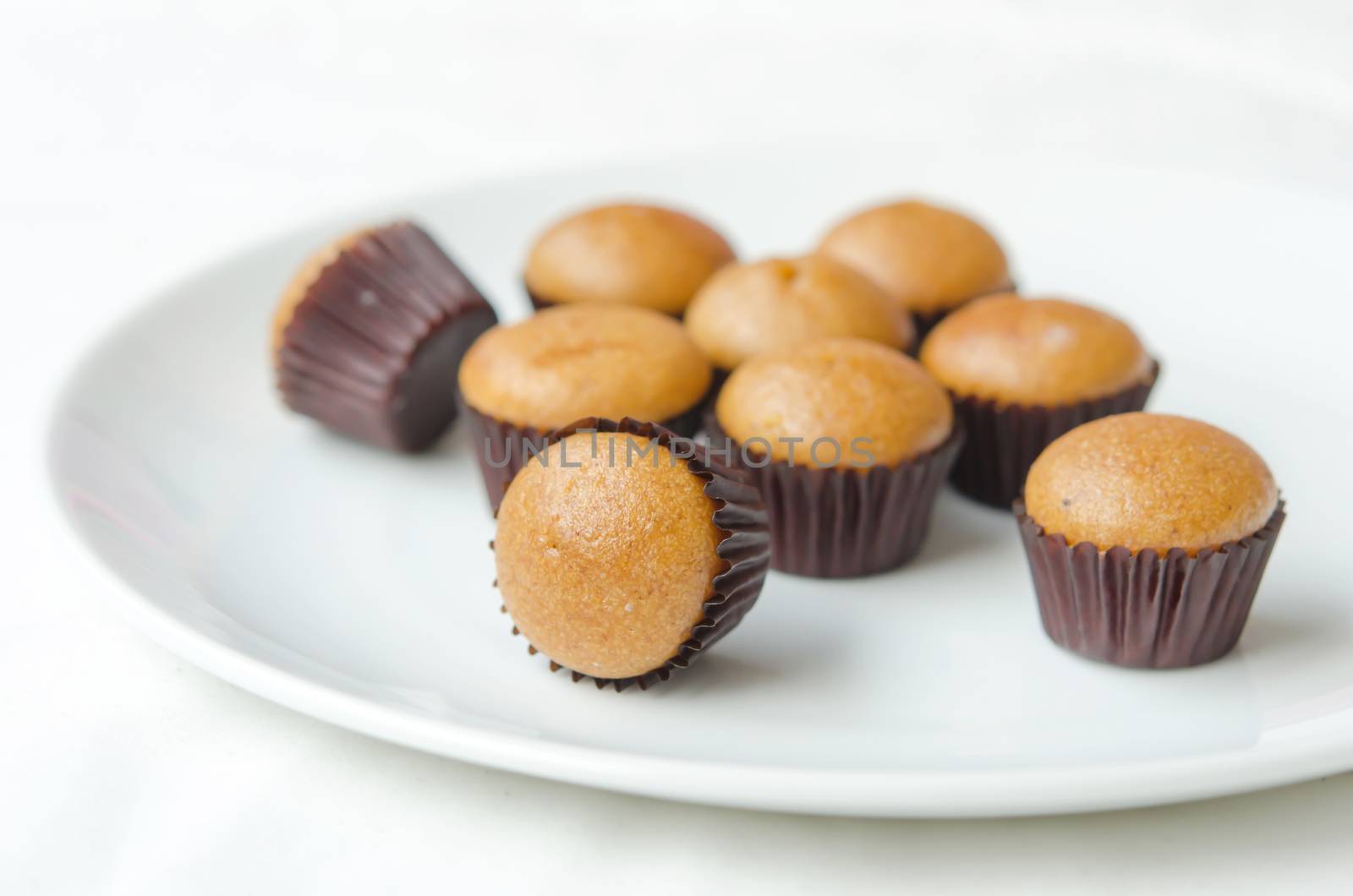 Homemade vegan banana muffins over white dish