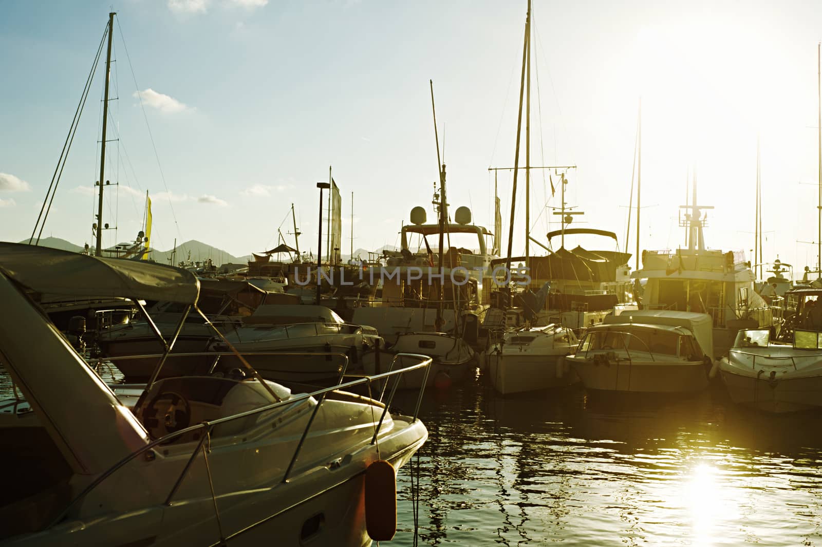 sunny autumn day in a bay,  luxury yachts moored in Cannes