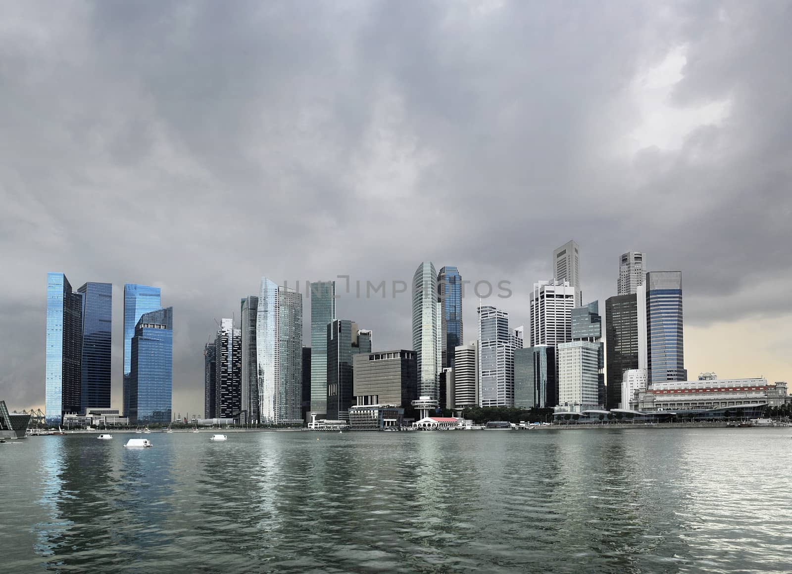 Skyline of Singapore with a dark stormy sky 