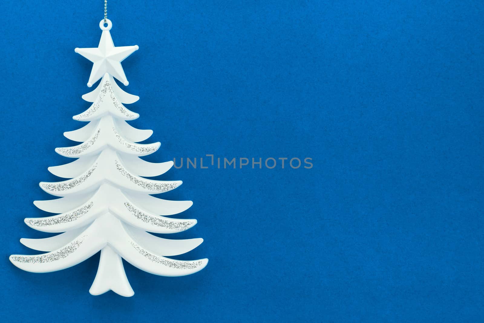 Christmas tree on a background of blue velvet paper