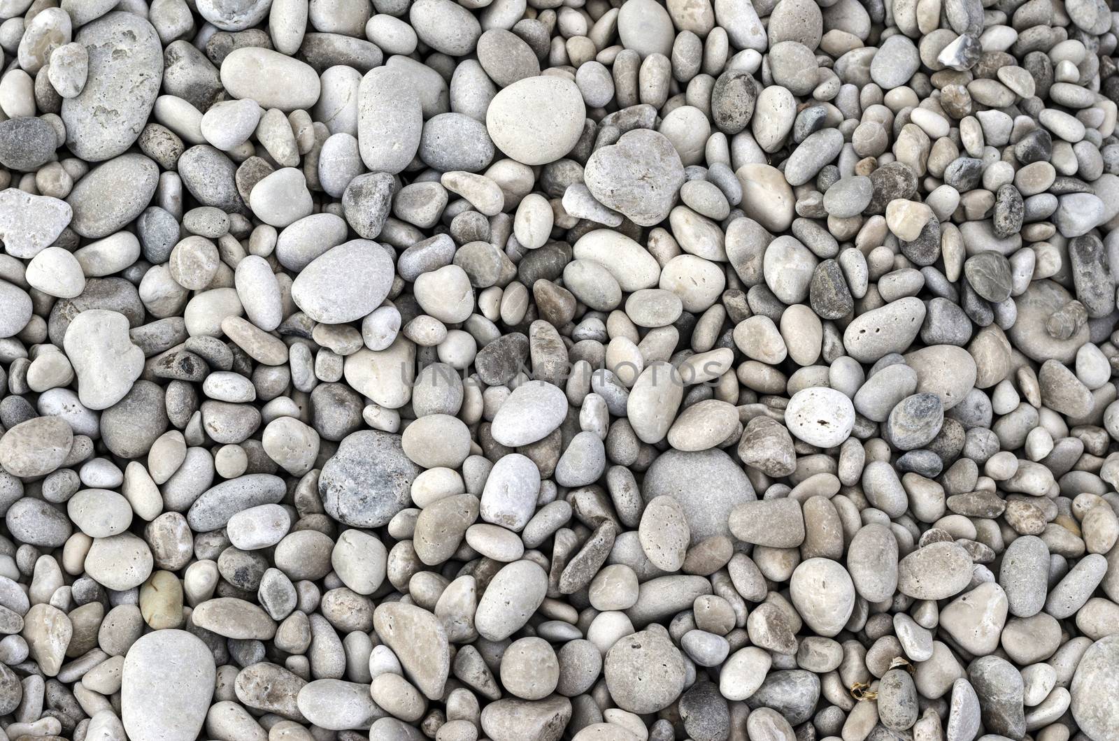 Texture of pebbles from a beach shore.