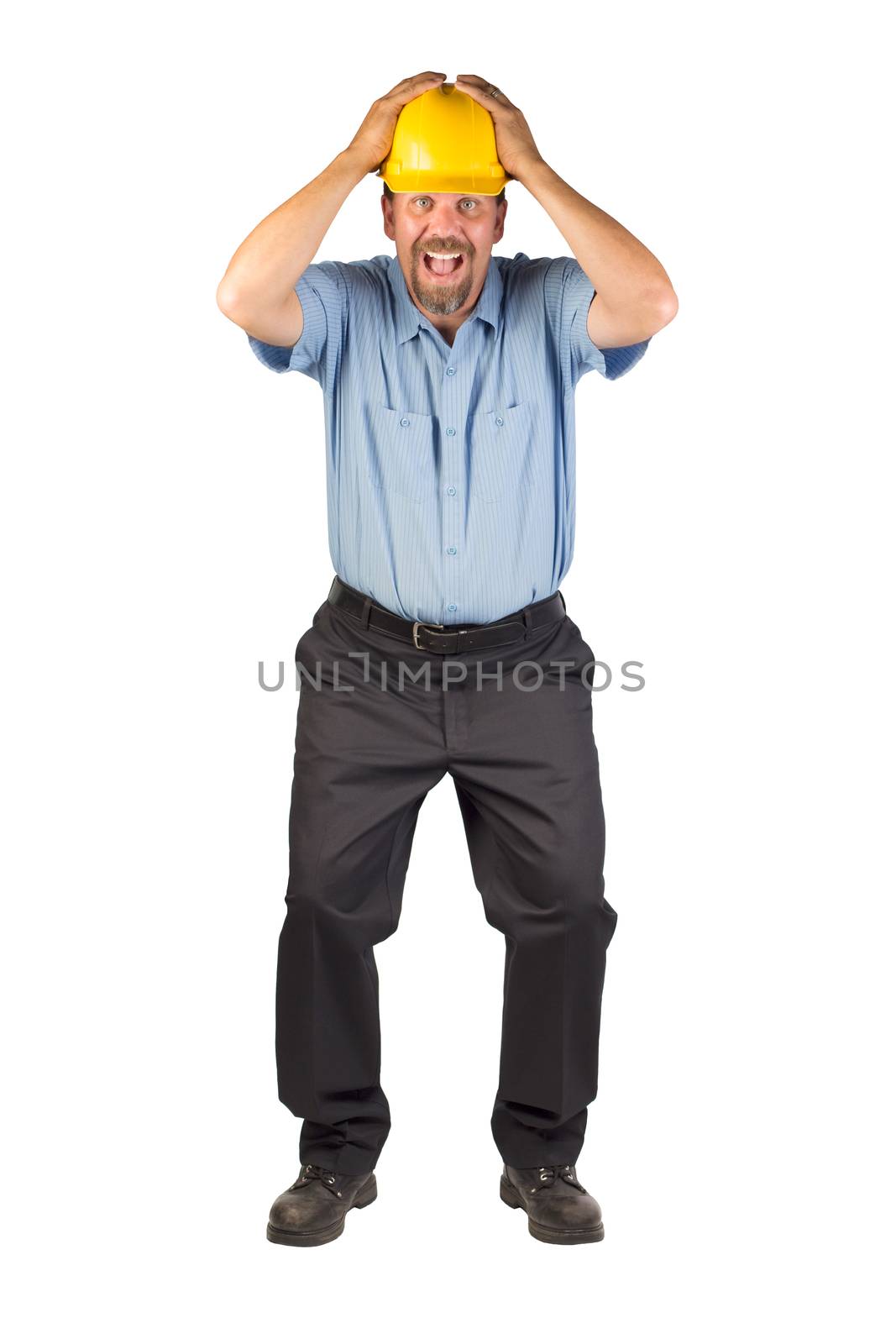 A construction type man with a hard hat is taking cover from something that could be falling from above. This man appears to be excited, nervous, anxious or stressed out. This blue collar worker could be a construction worker, maintenance engineer, public utilities worker, electrician or other mainstream worker.