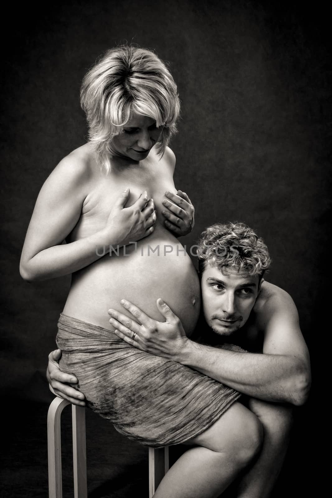 Loving happy couple, pregnant woman with her husband by artush