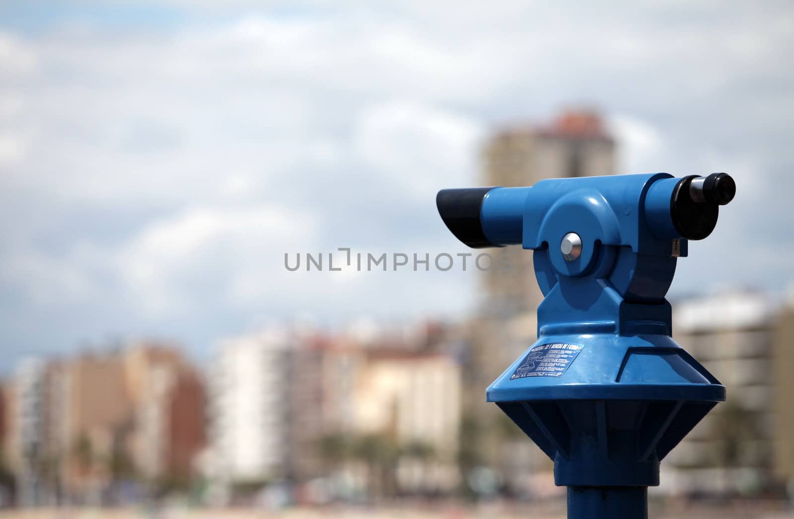 A coin operated Telescope for viewing a city of skyscapers