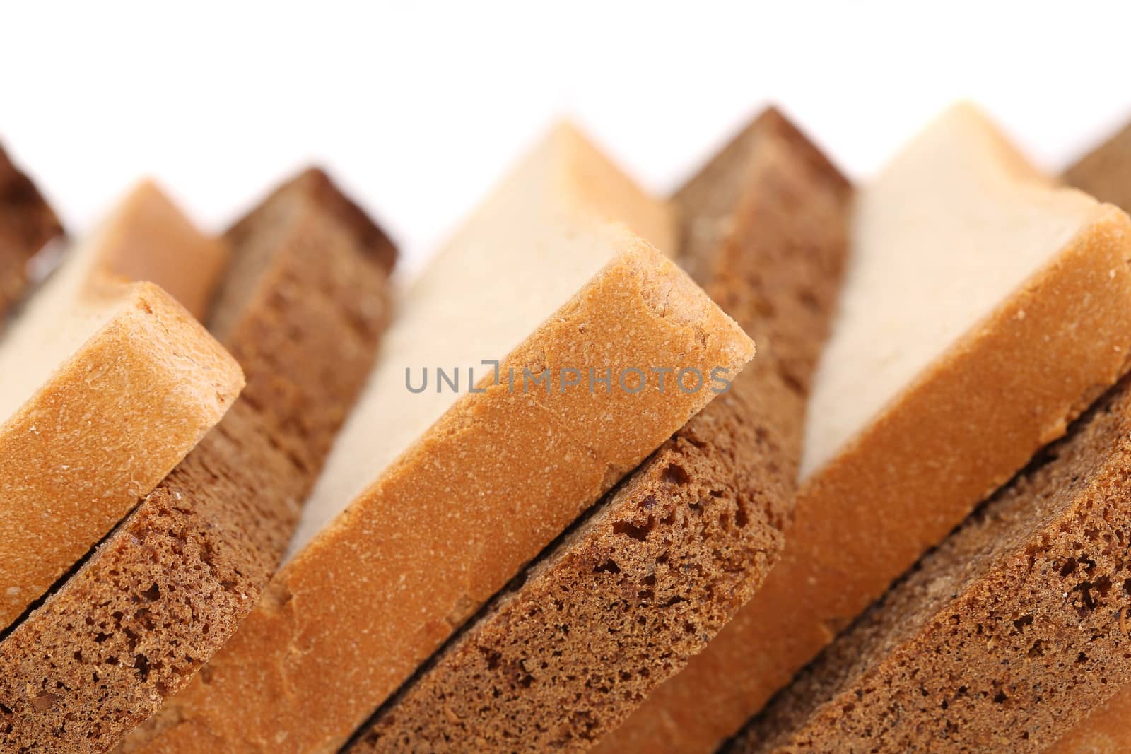 Slices of brown and white bread. Close up.