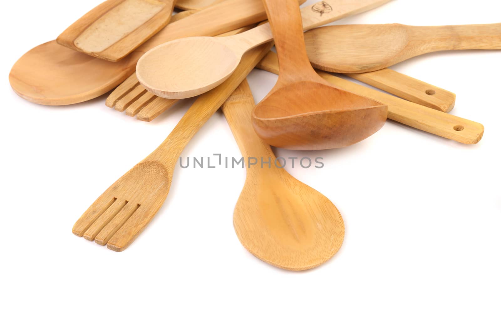 different kitchen wooden utensils cutlery close up on a white background