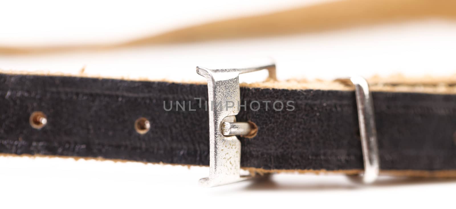 Black leather belt with a rectangular buckle isolated on white background