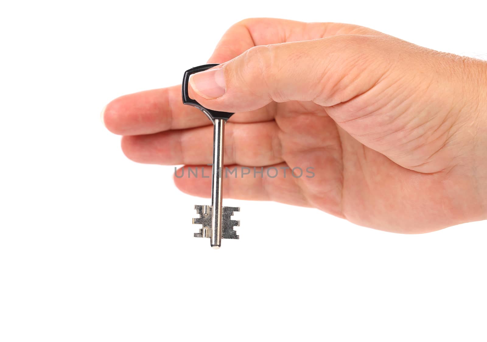 Hand holds modern steel-plastic key. White background.