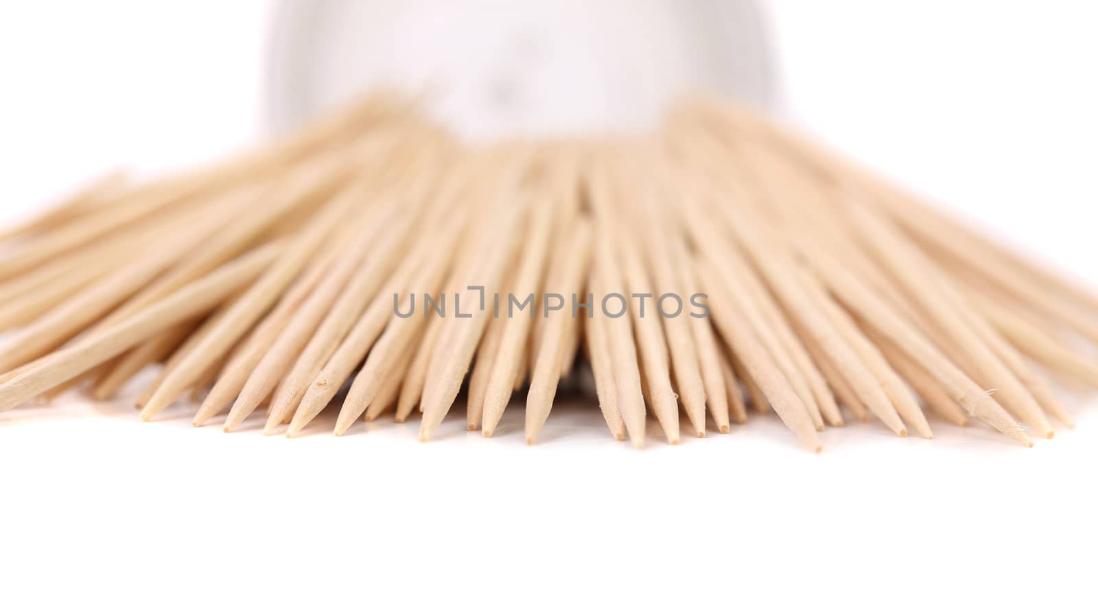 Toothpicks get out round box. White background.
