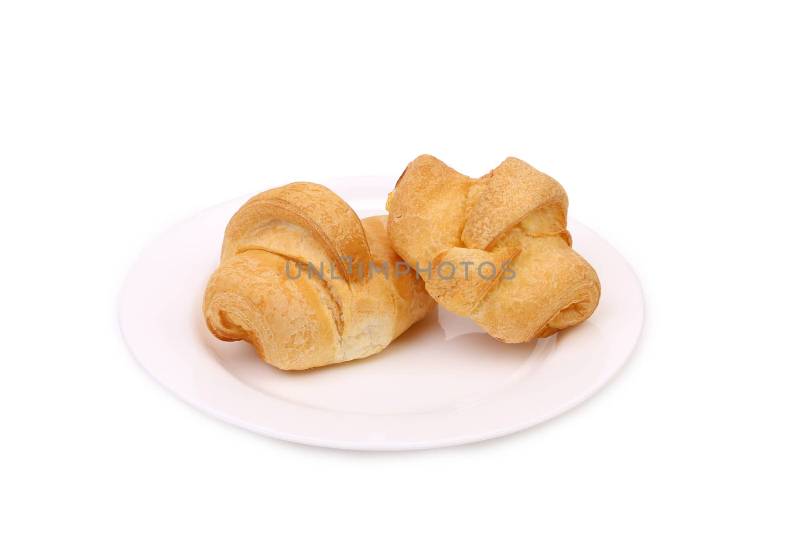 Fresh croissants on plate. Isolated on a white background.