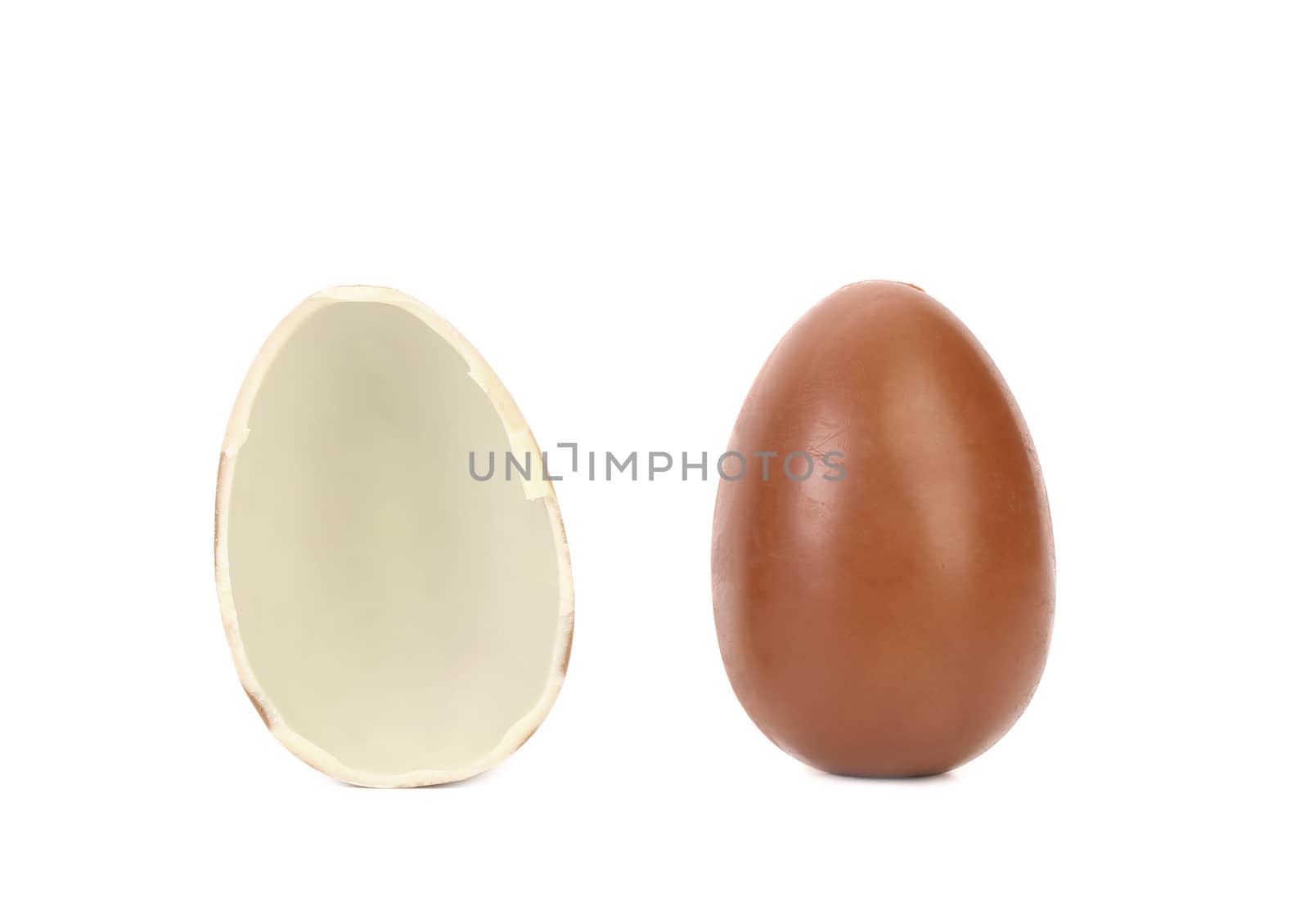 One and half chocolate egg. White background.