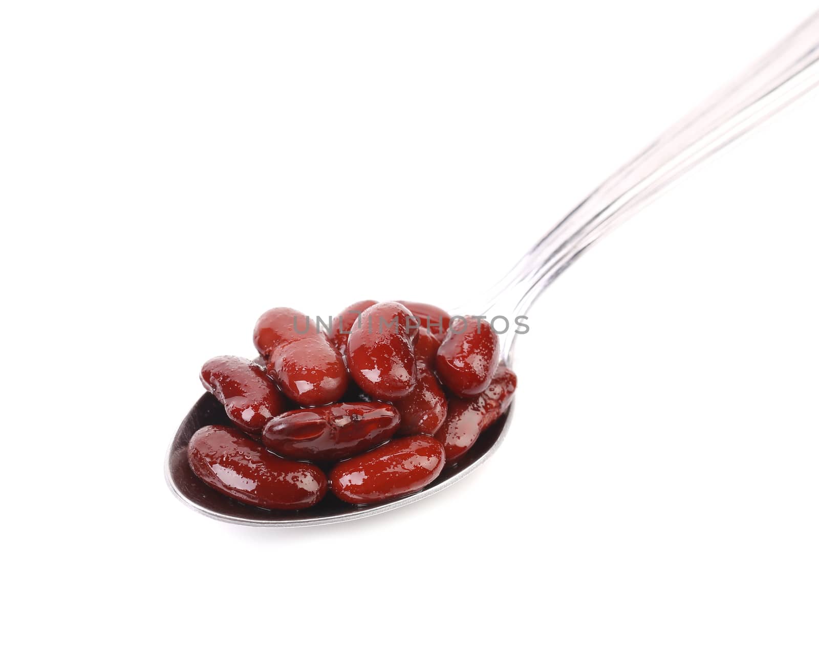 Preserve beans on a spoon. White background.