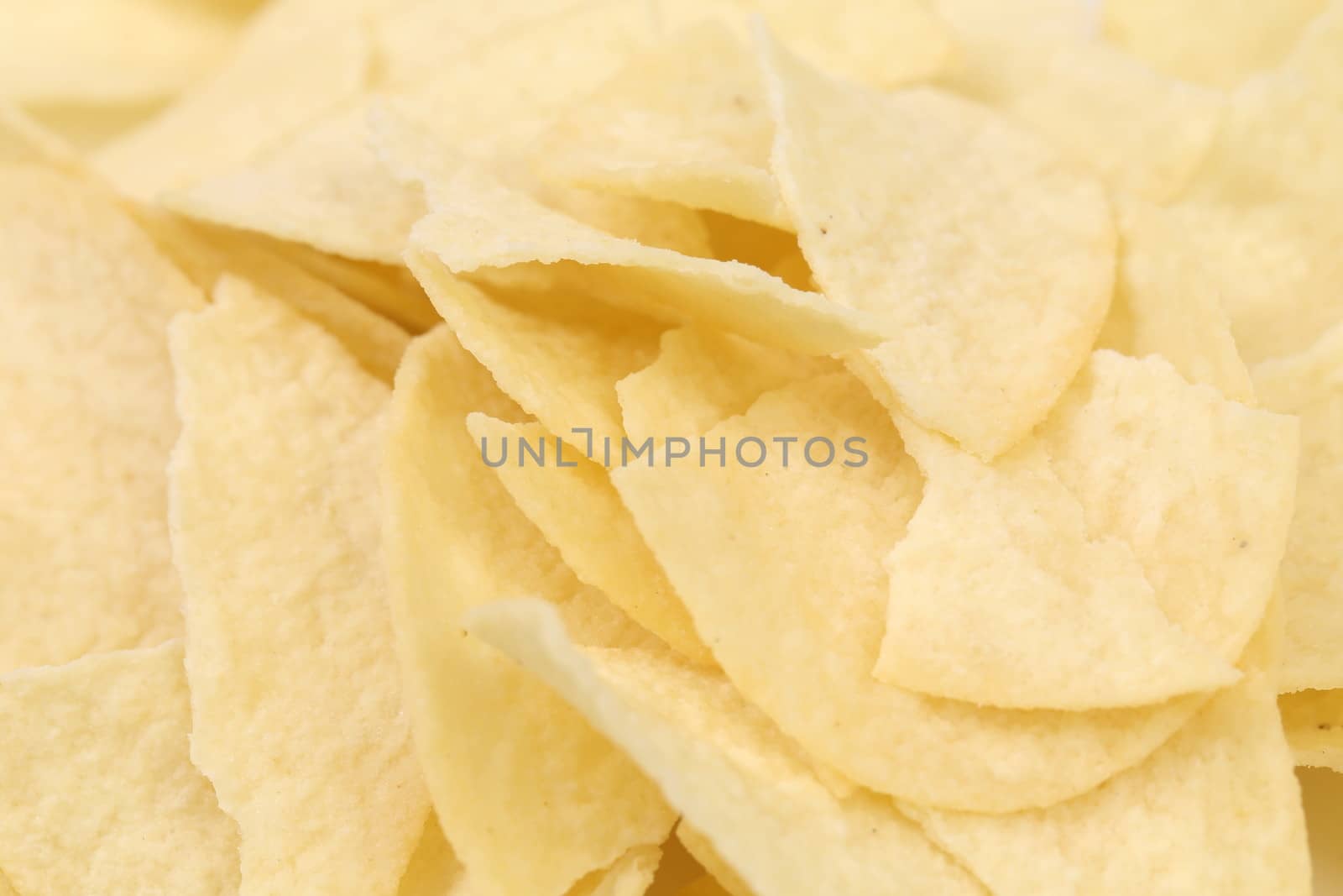Background of potato chips. Close up. Texture.