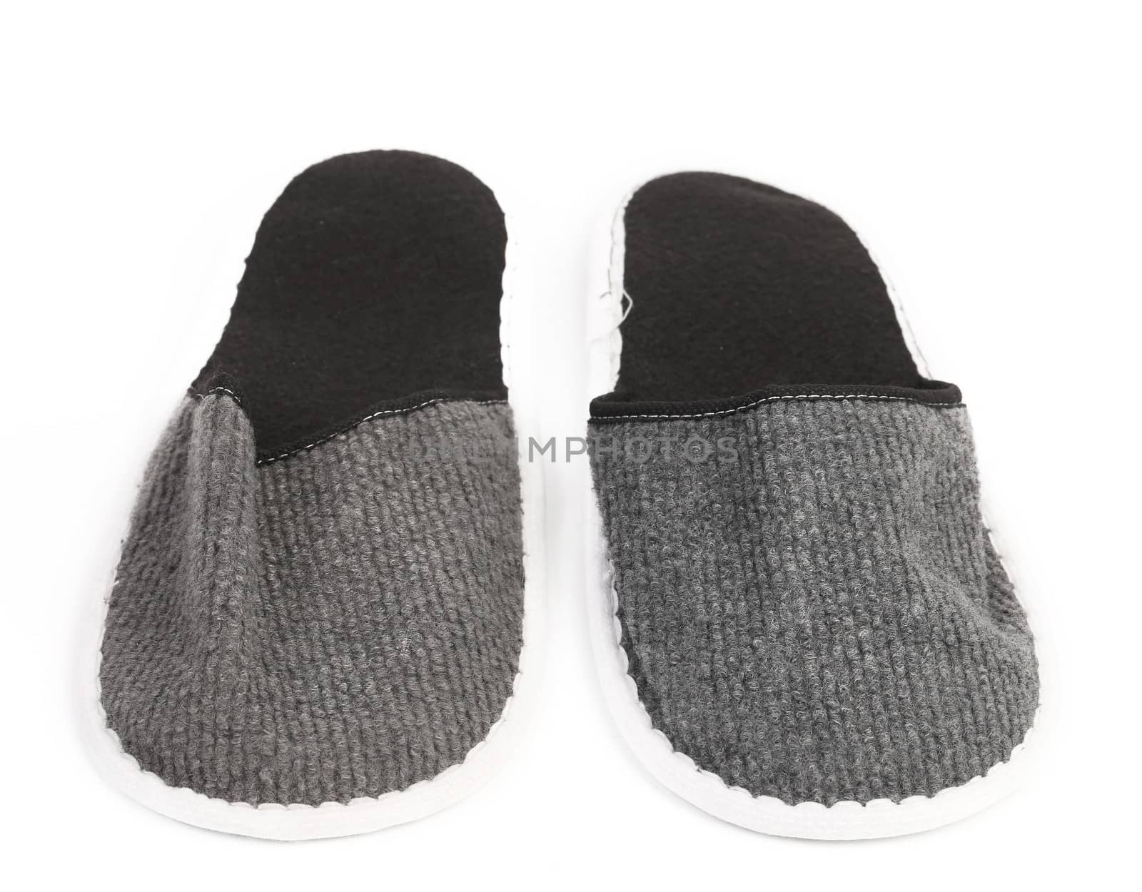 Pair of gray slippers on a white background. Close up.