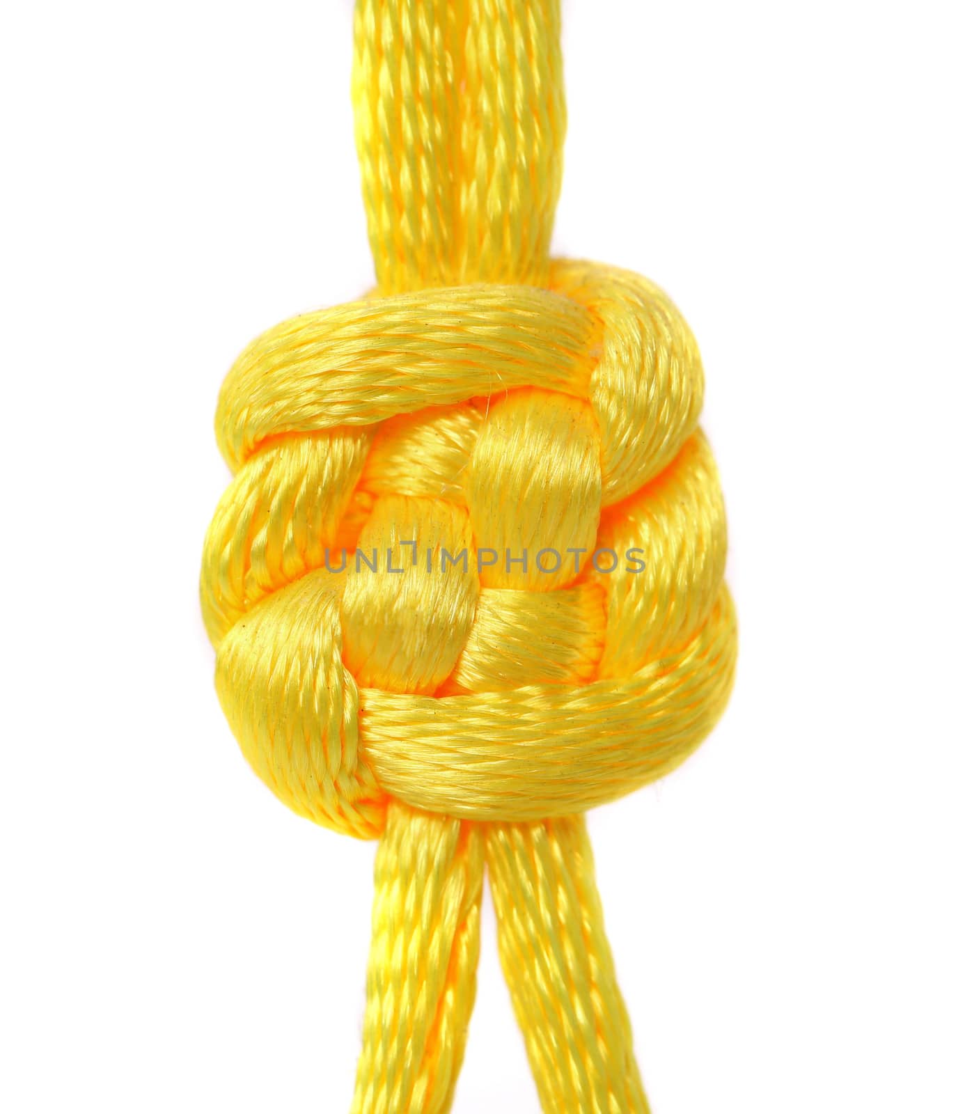 Knot of yellow silk lace. Close up.
