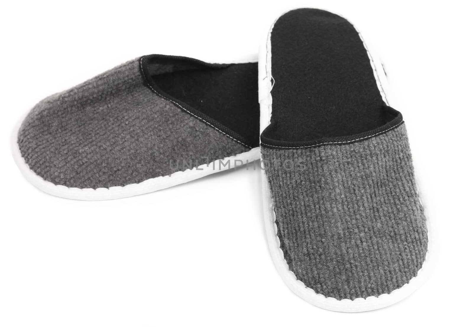 Pair of gray slippers on a white background. Close up.
