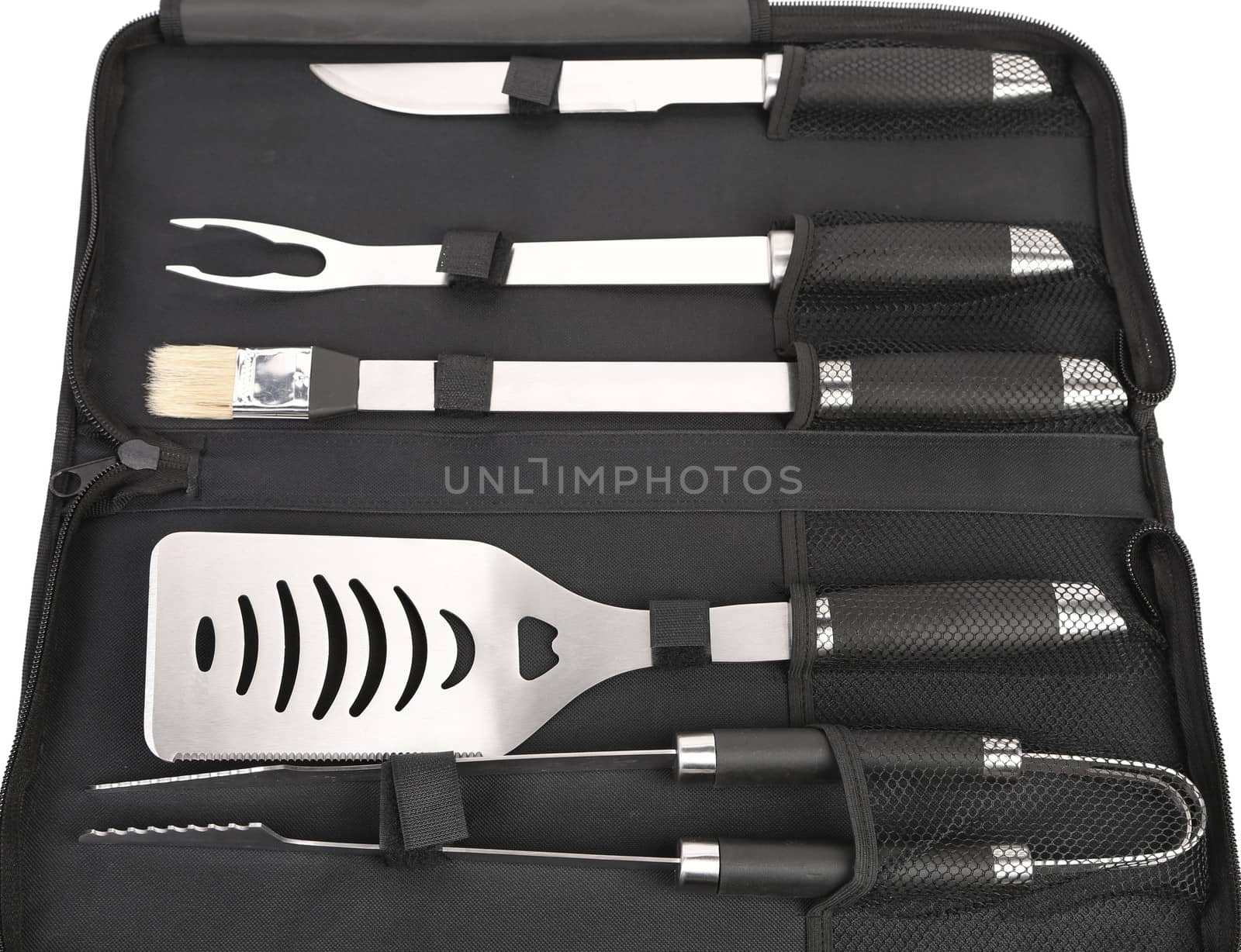 Set of tools for bbq in black bag. Close up.
