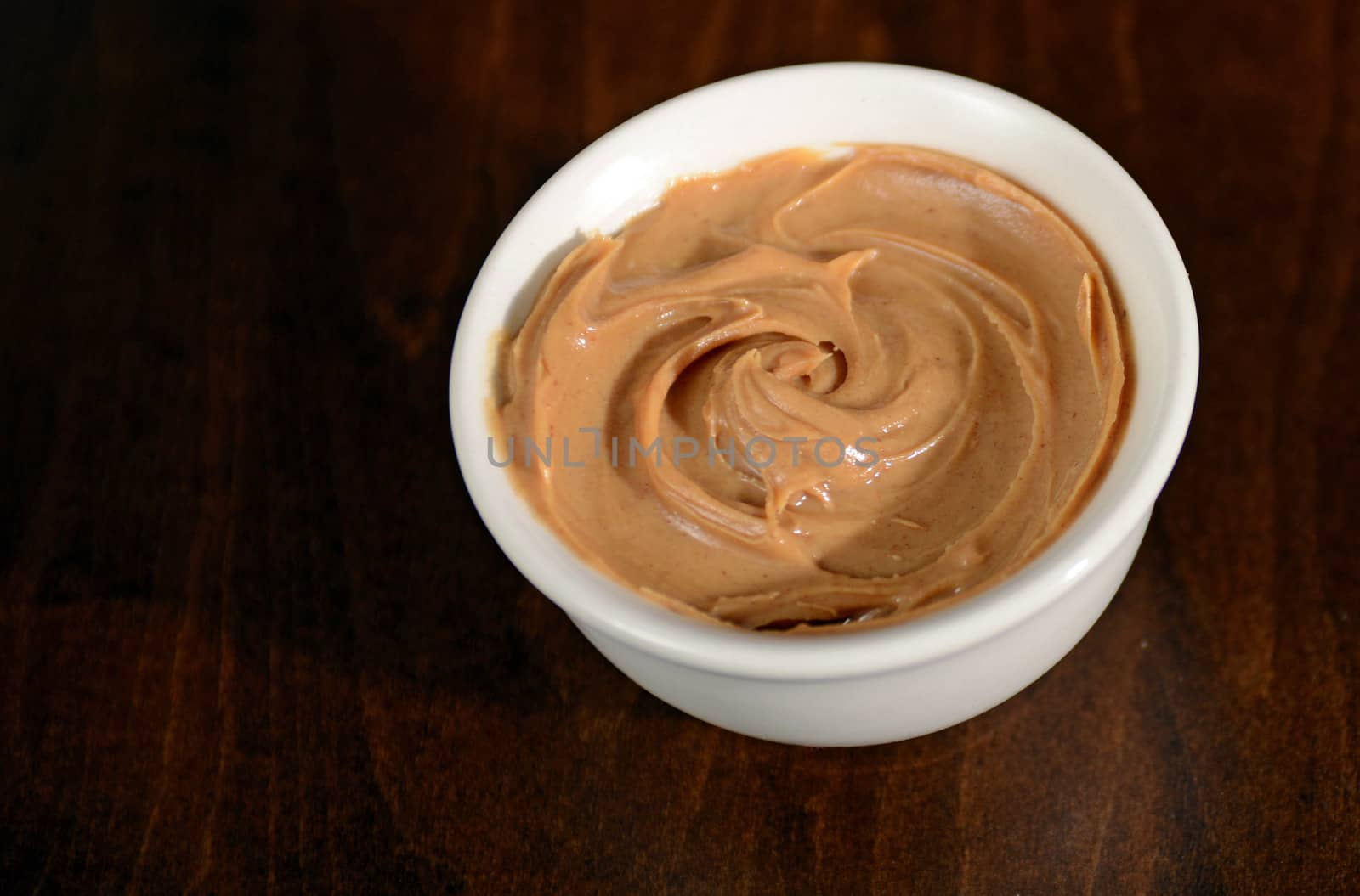 bowl peanut butter dish on wood