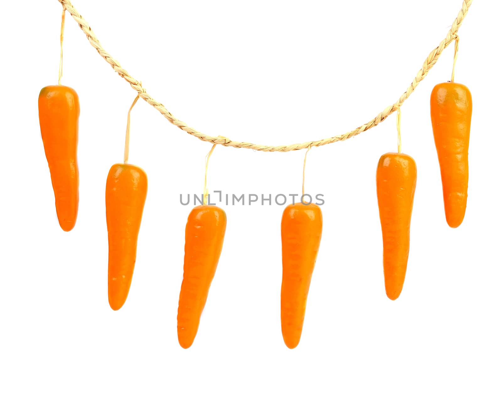 Close-up of a toy carrot. Isolated on a white background.