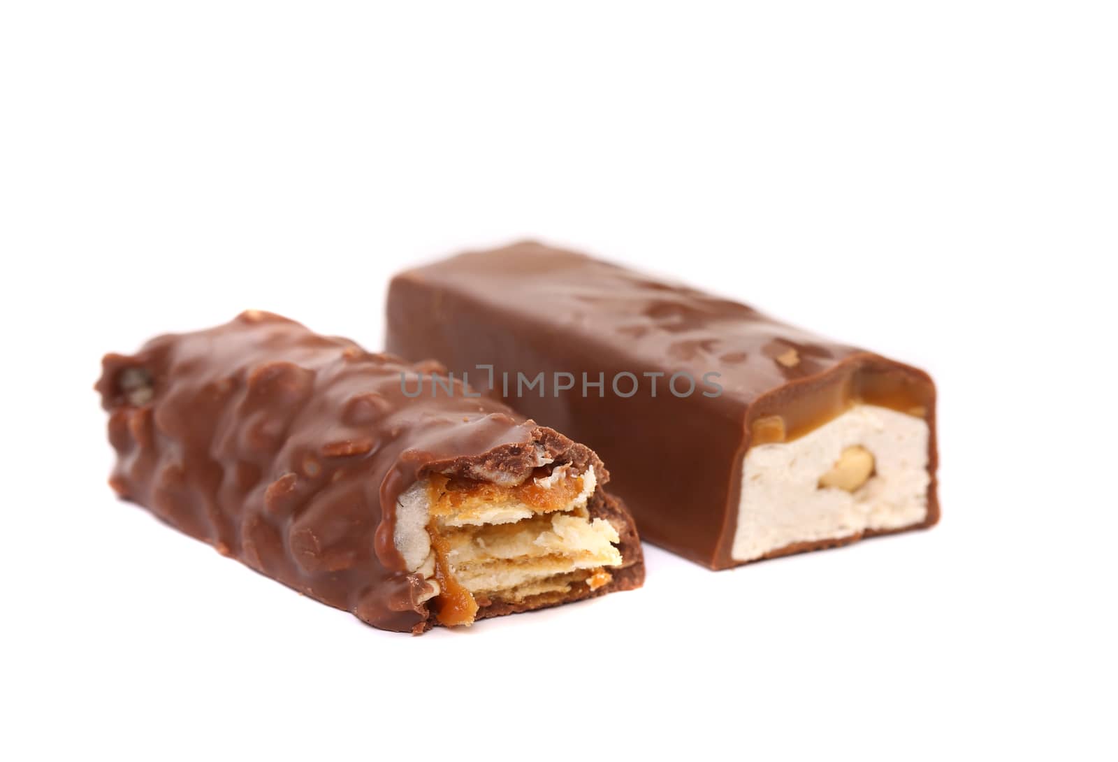 Two halfs of different chocolate bars. White background.