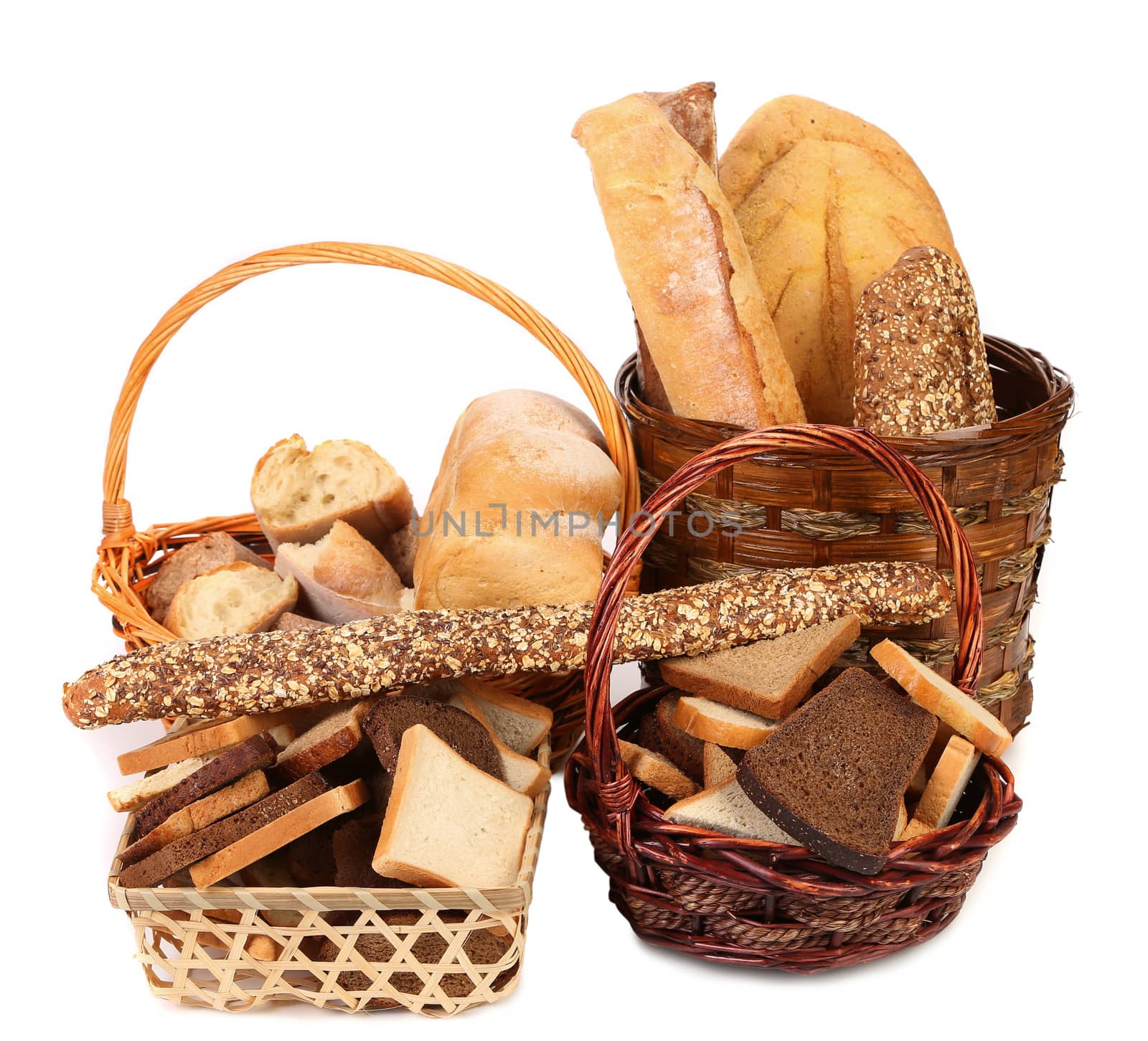 Composition of breads and baskets. White baackground.