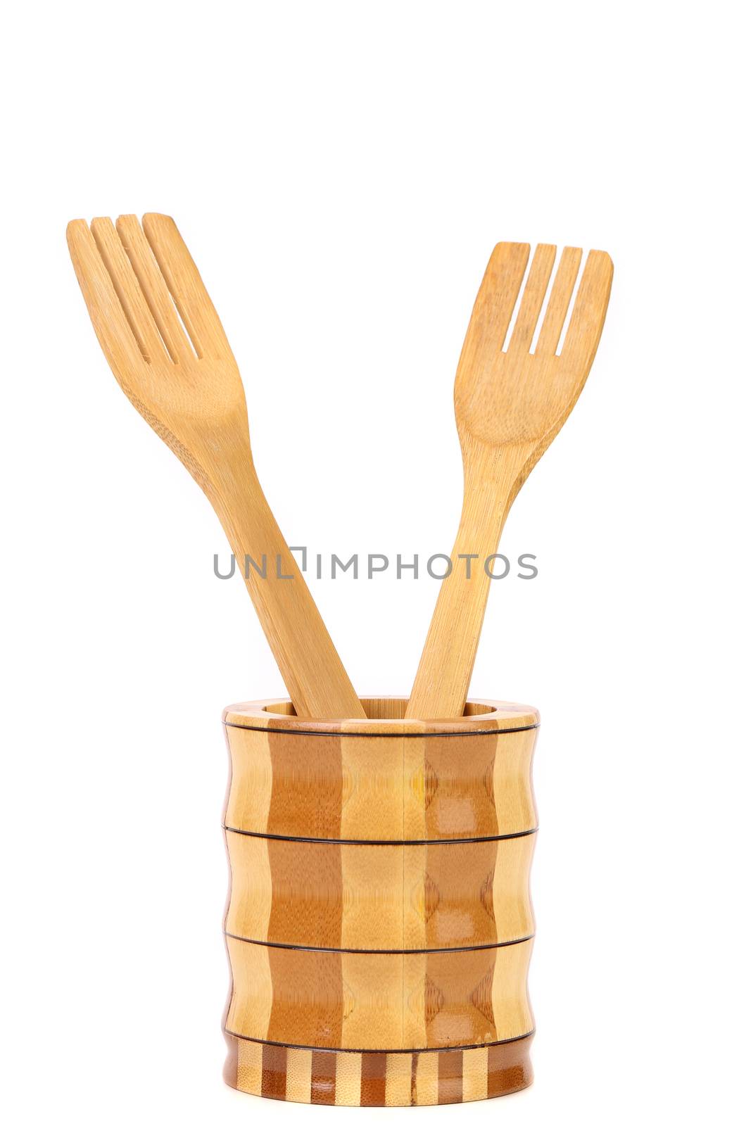 Wooden kitchen utensils in a jar. White background.
