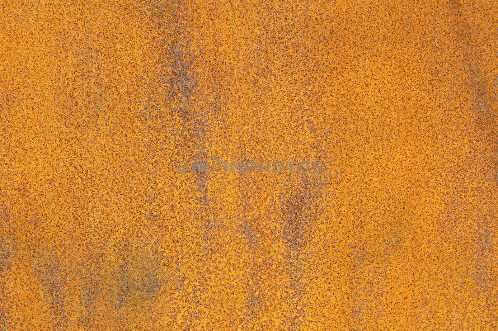 Orange Patterns on the Rusty Surface of the Metal