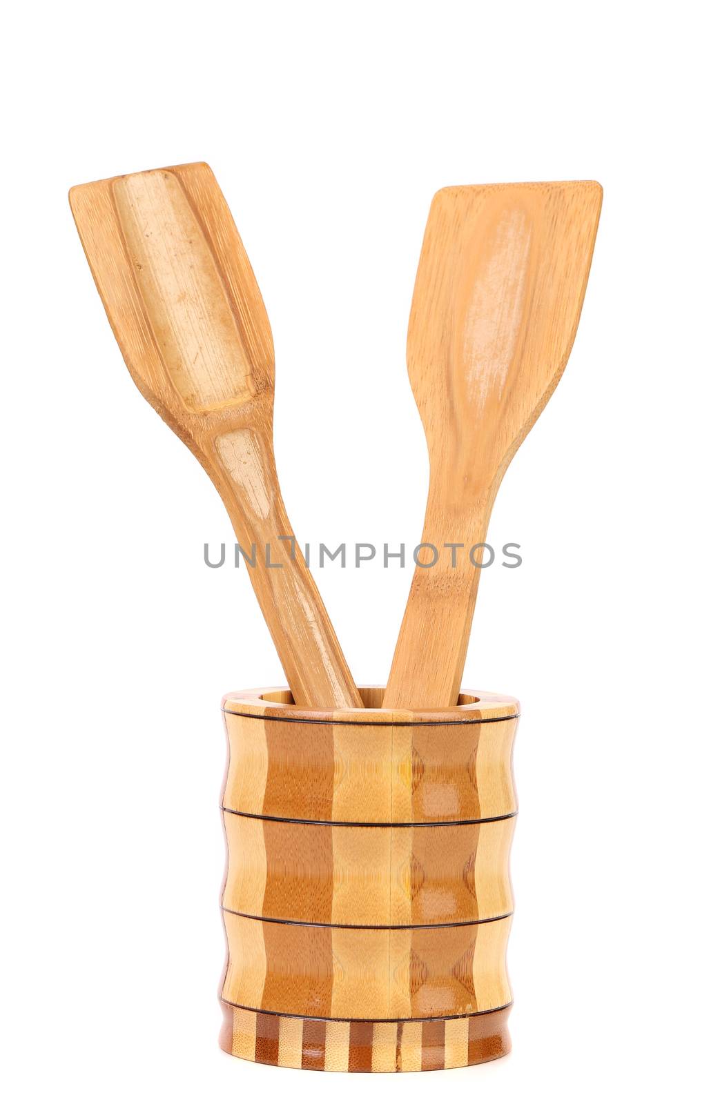 Wooden kitchen utensils in a jar. White background.