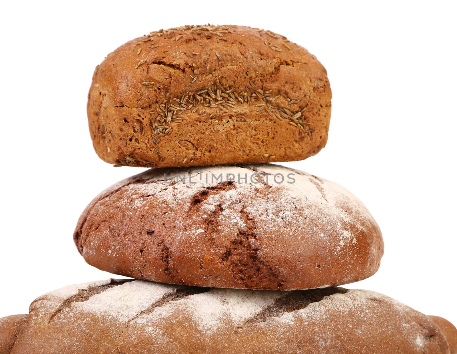 Pyramid of brown breads. Isolated on a white background.
