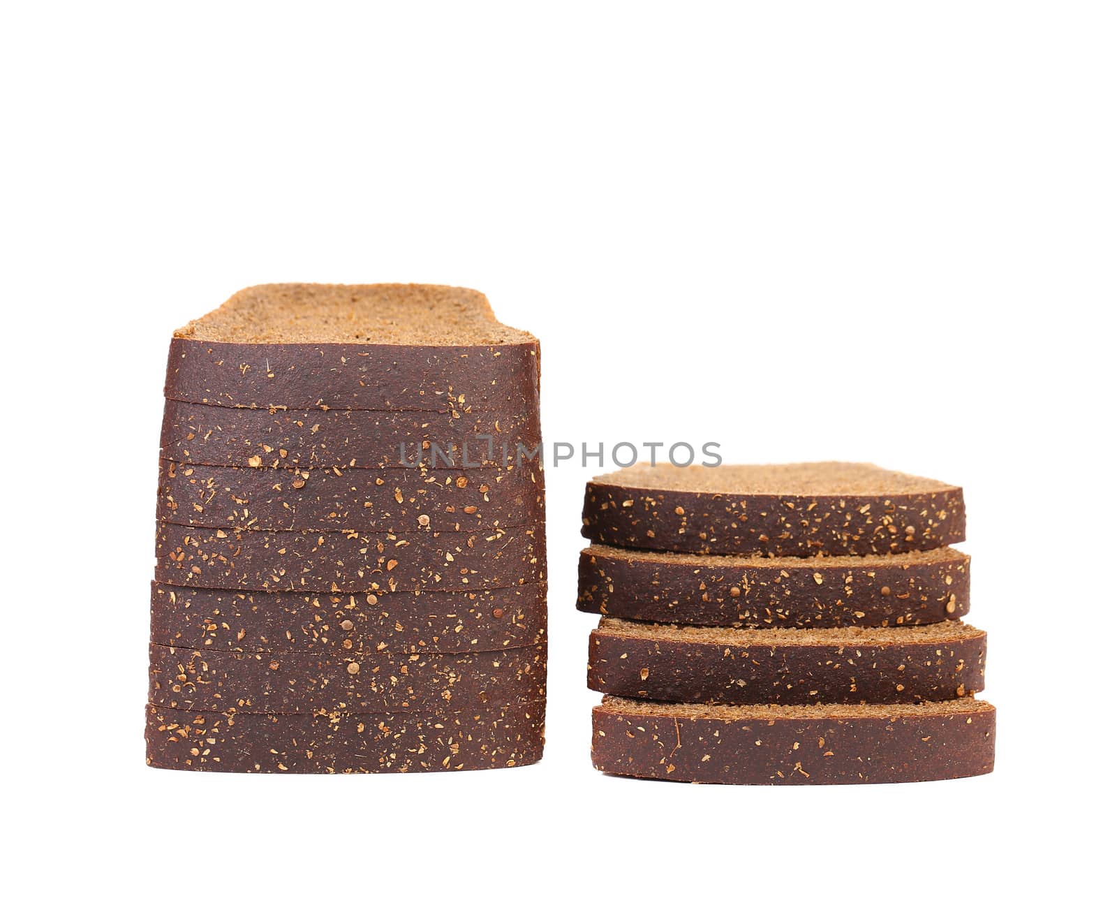 Stacks of brown bread. Isolated on a white background.