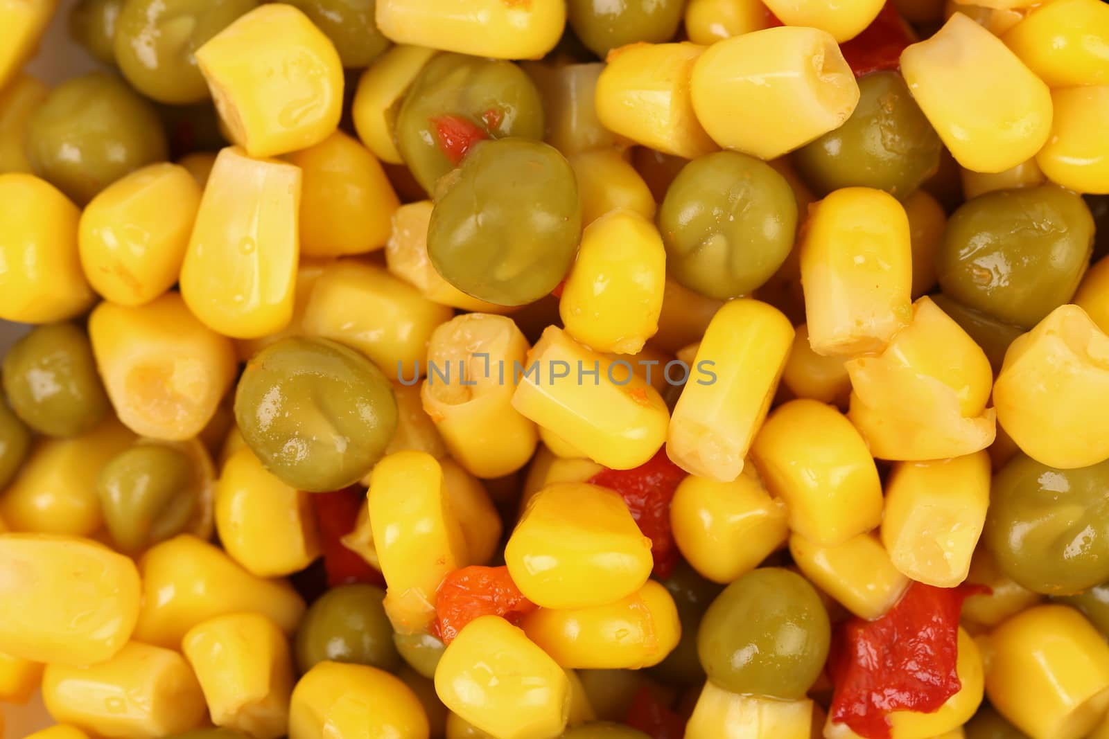 Corn and peas with tomatoes. Close up. Background.