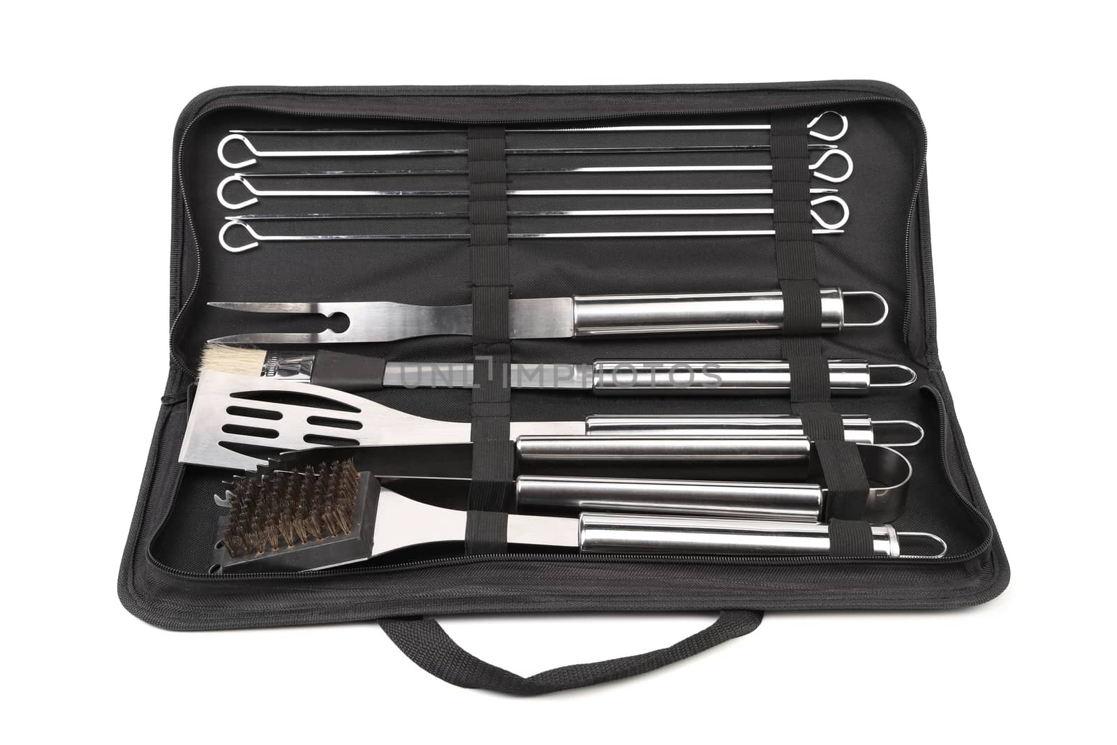 Set of tools for bbq in black bag. White background.