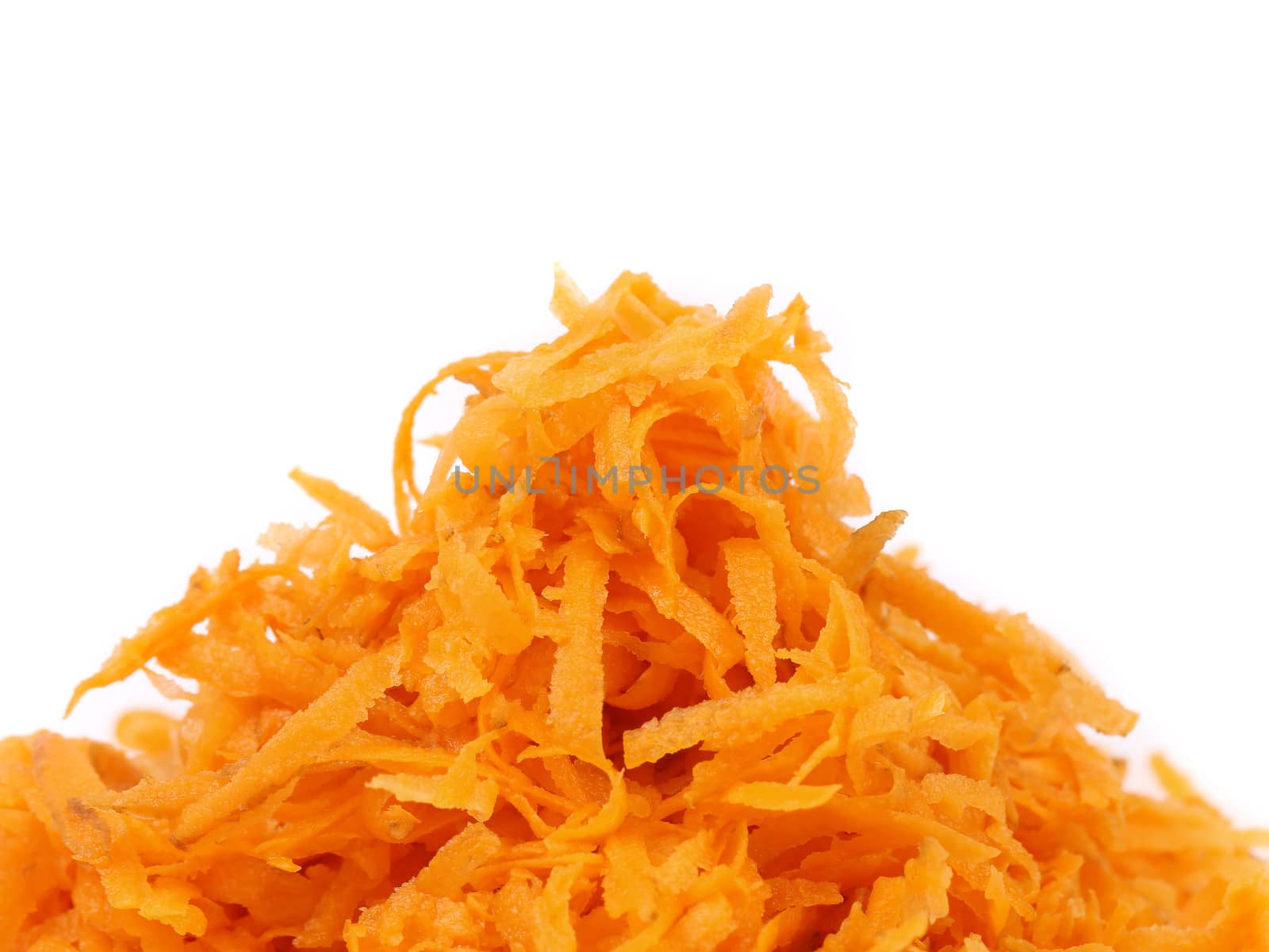 heap grated carrot isolated on a white background