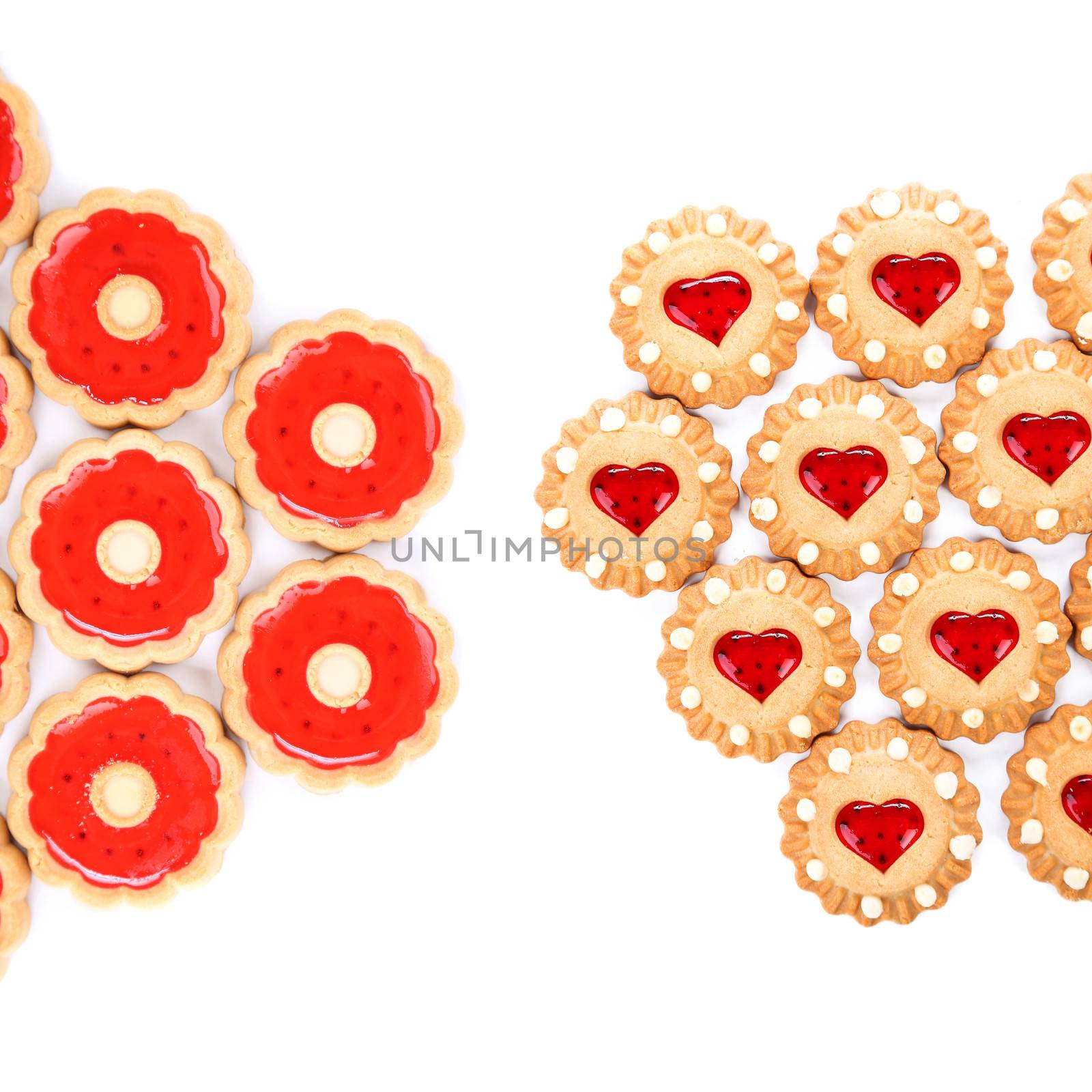 Heart and round shaped strawberry biscuits. White background.