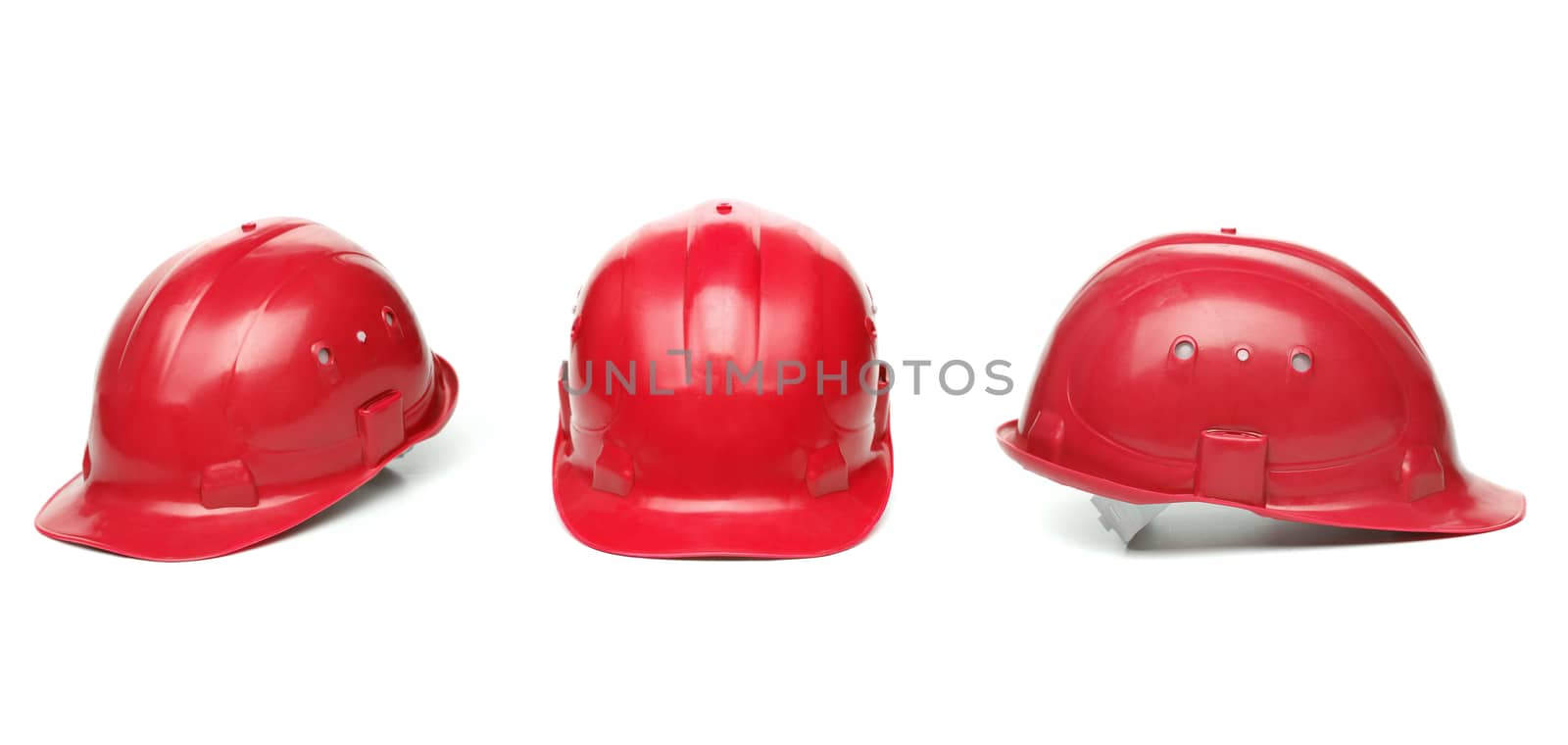 Three identical red hard hat. White background.