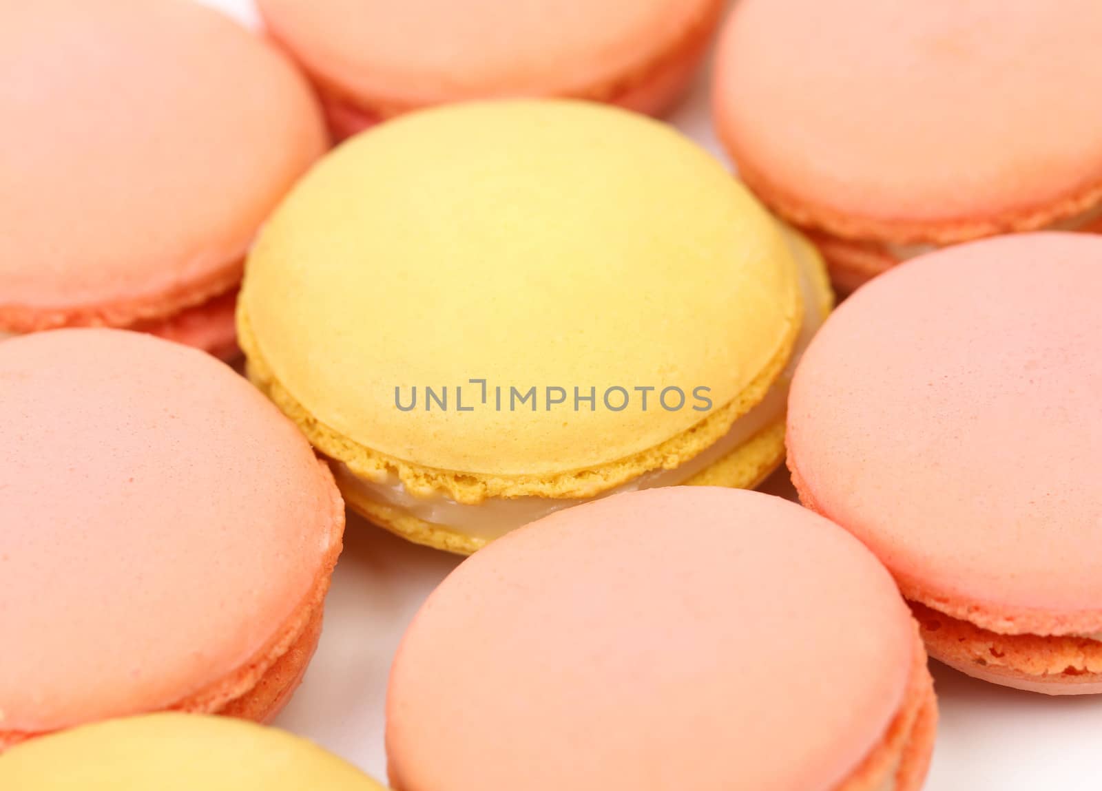 Background of seven various macaron cakes. Hexahedron