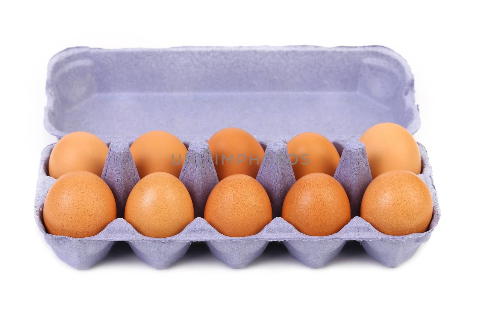 The brown eggs in a blue egg box