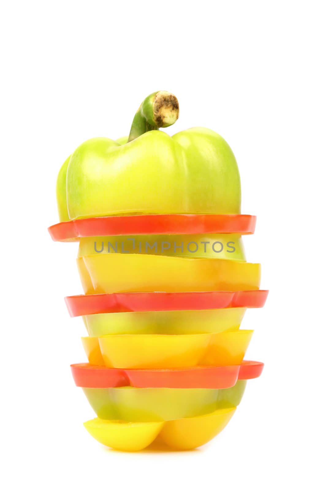 Slices of colorful bell pepper isolated on white background