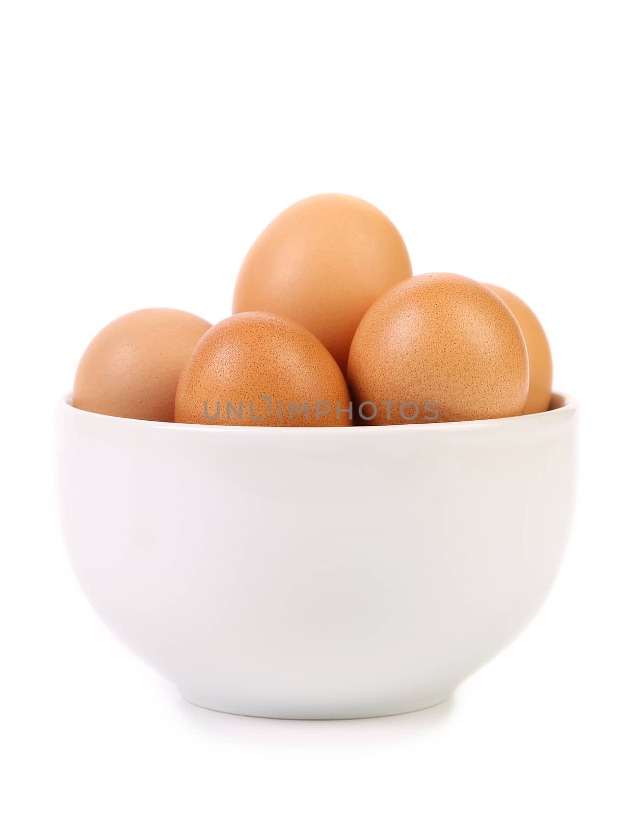 bowl with brown eggs on white background